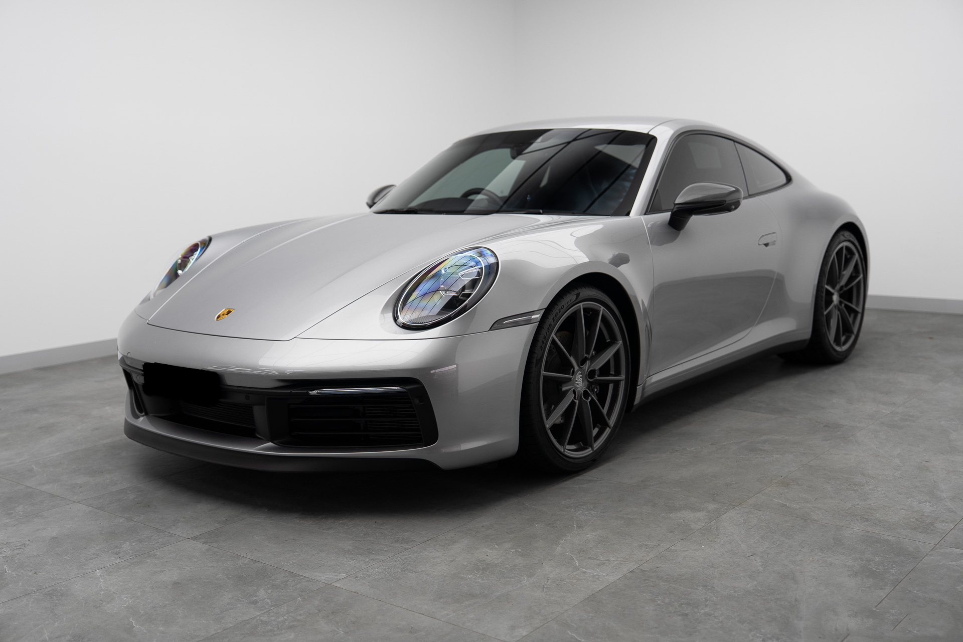 Silver Porsche 911 in the Liquid R studio bay