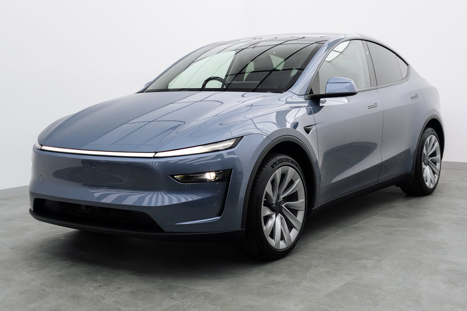 Blue Tesla Model Y in the Liquid R studio