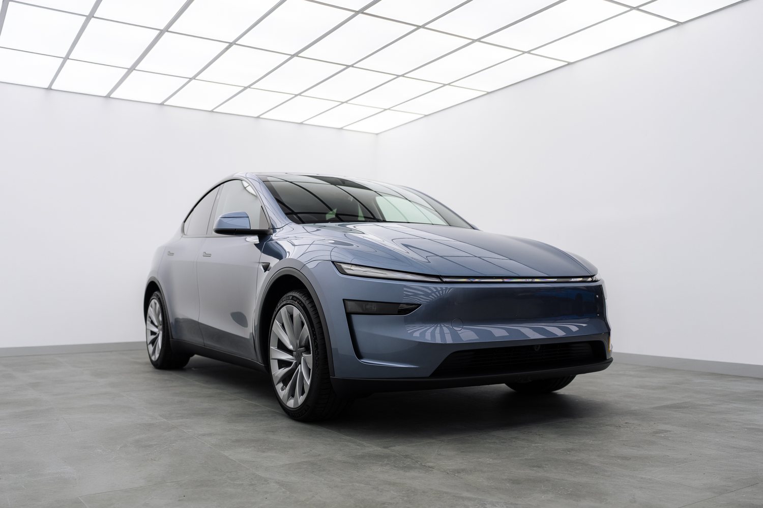 Blue Tesla Model Y in the Liquid R studio