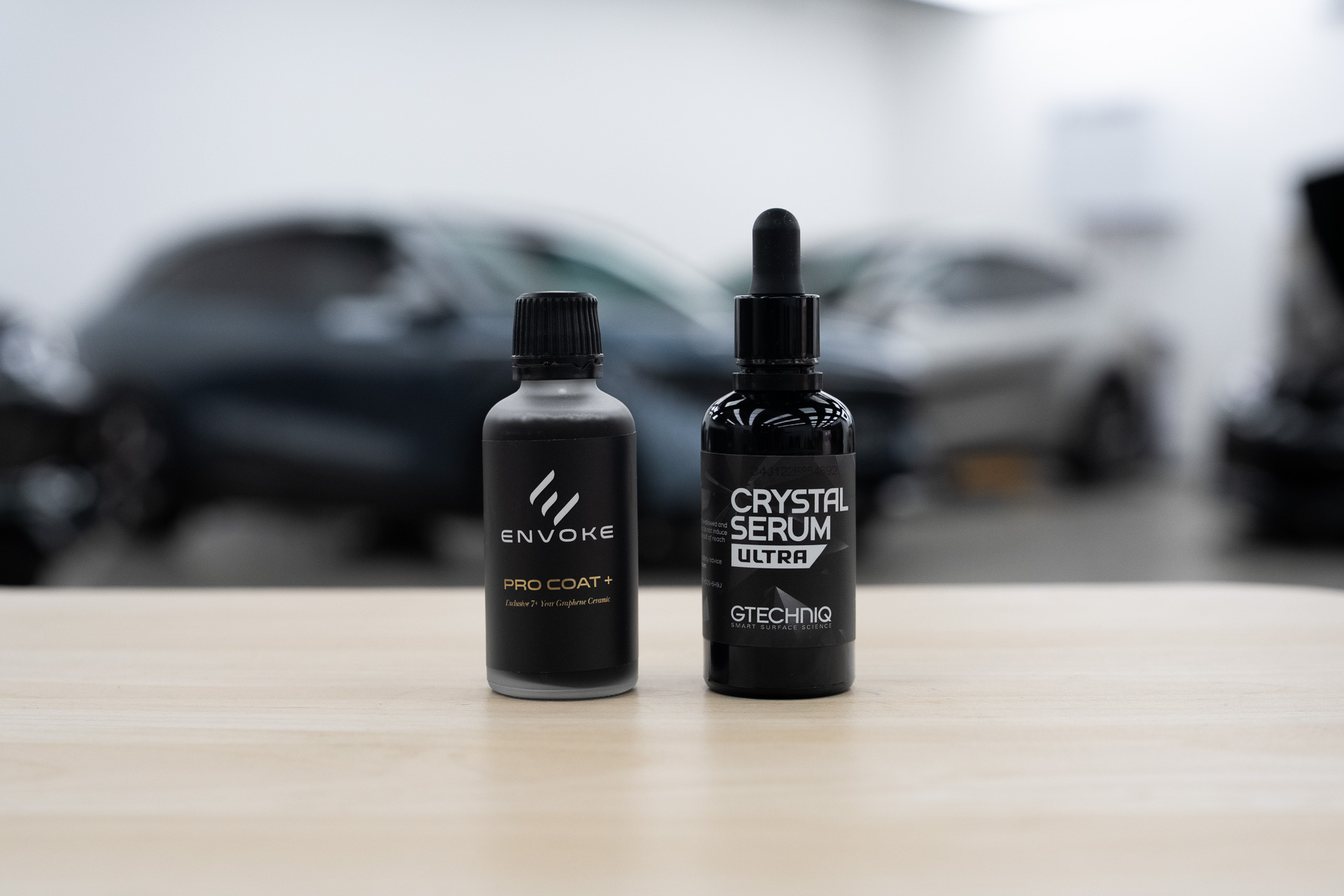Envoke graphene coating and Gtechniq Crystal Serum Ultra bottles side by side