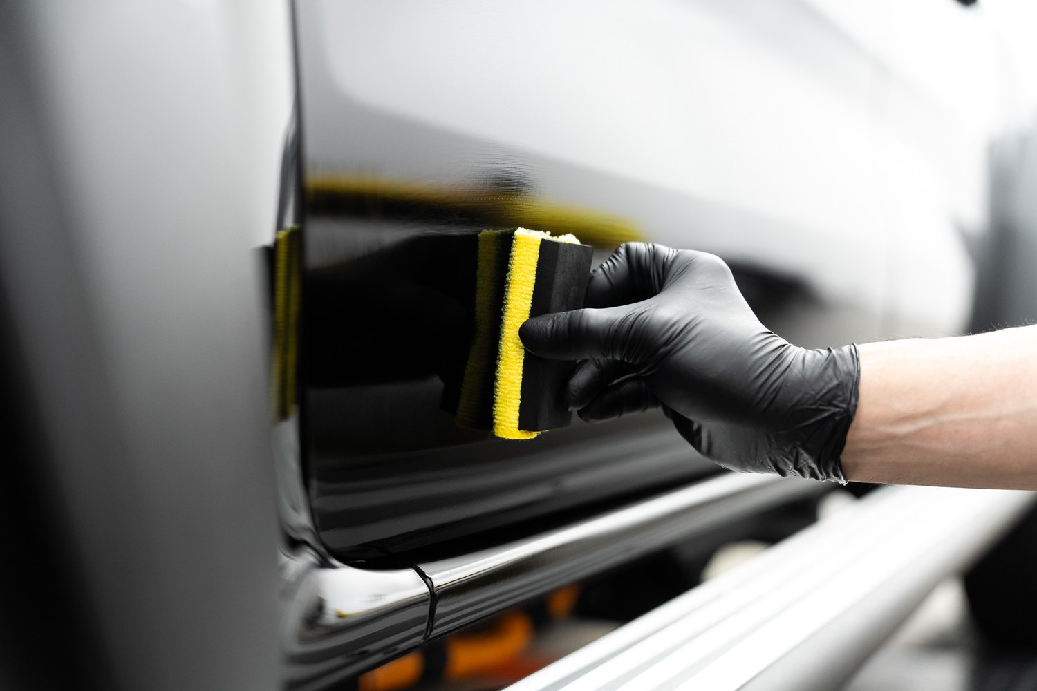 Ceramic coating being applied with an applicator block