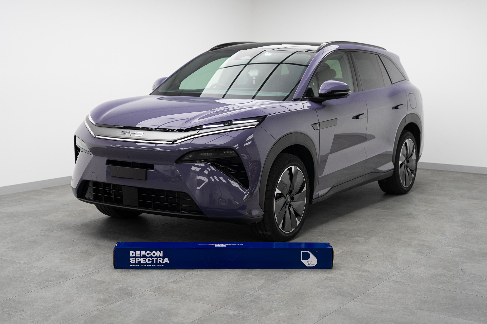 Purple colour transformed SUV with Defcon Spectra film roll