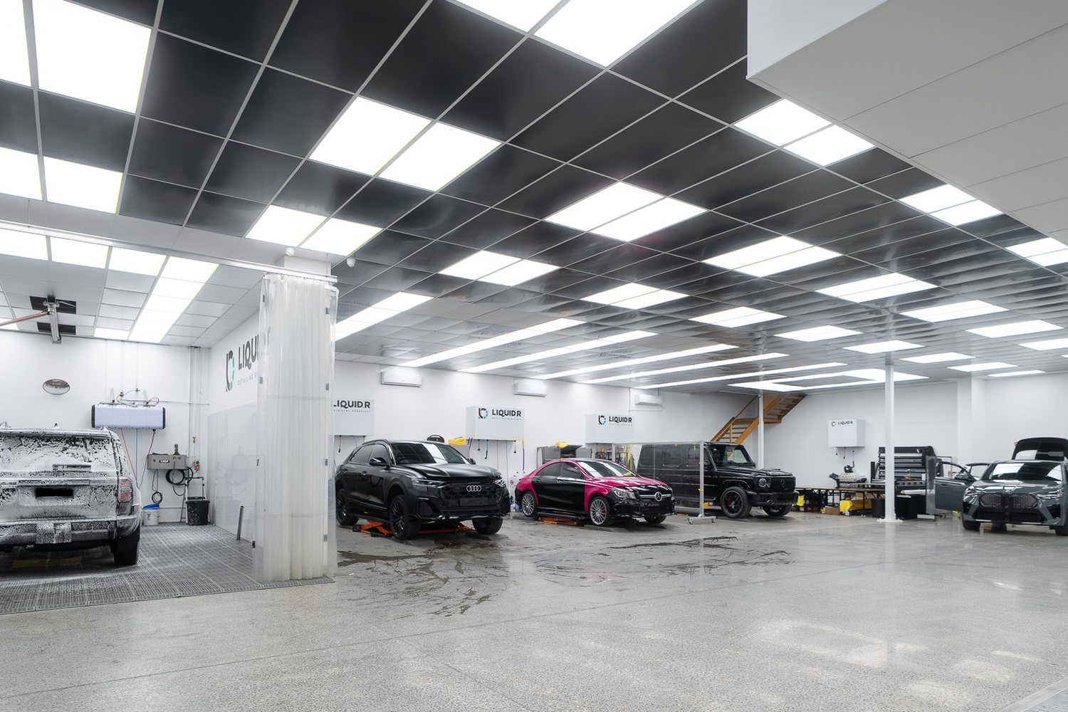 Customer cars in the Liquid R workshop