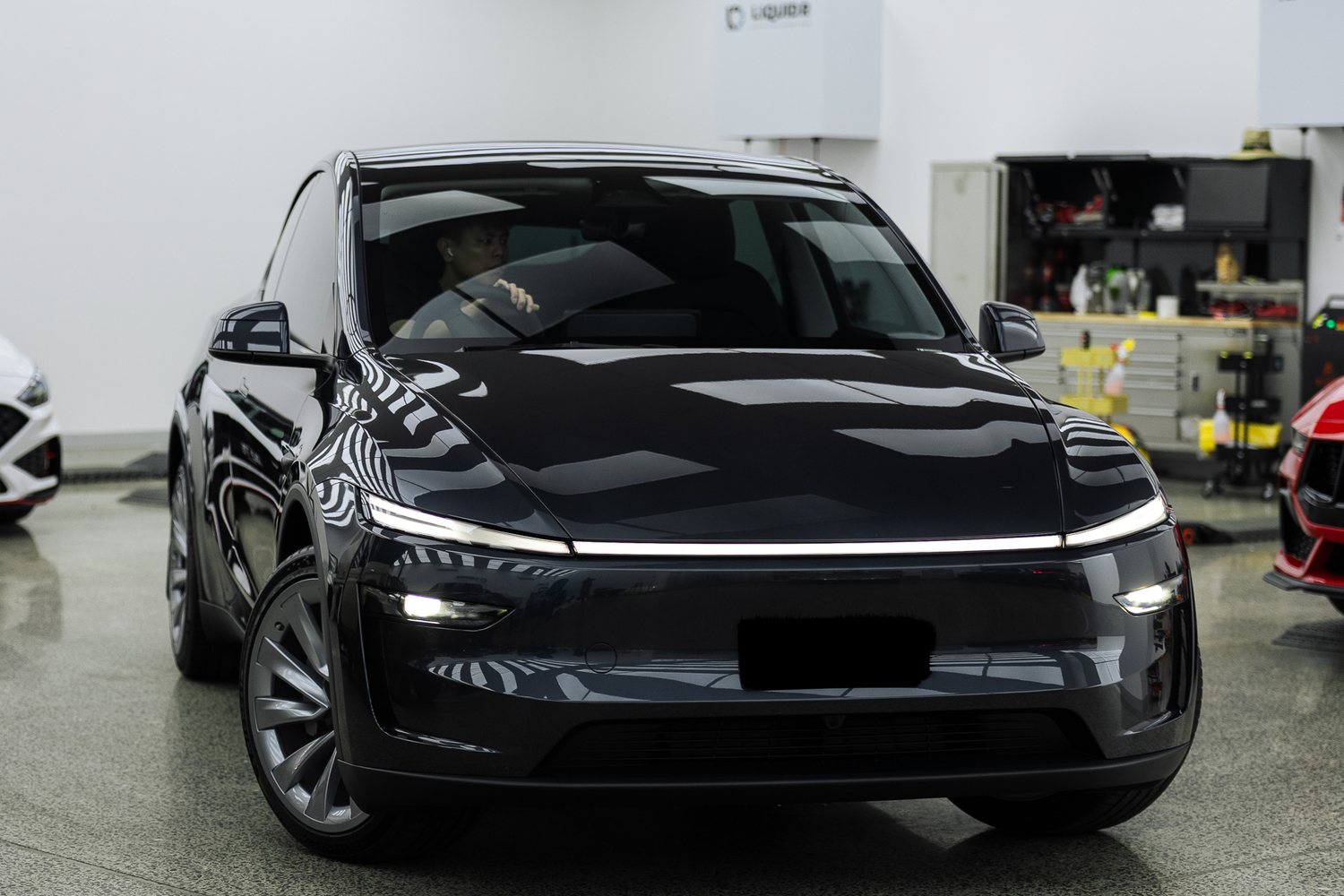Customer cars in the Liquid R workshop
