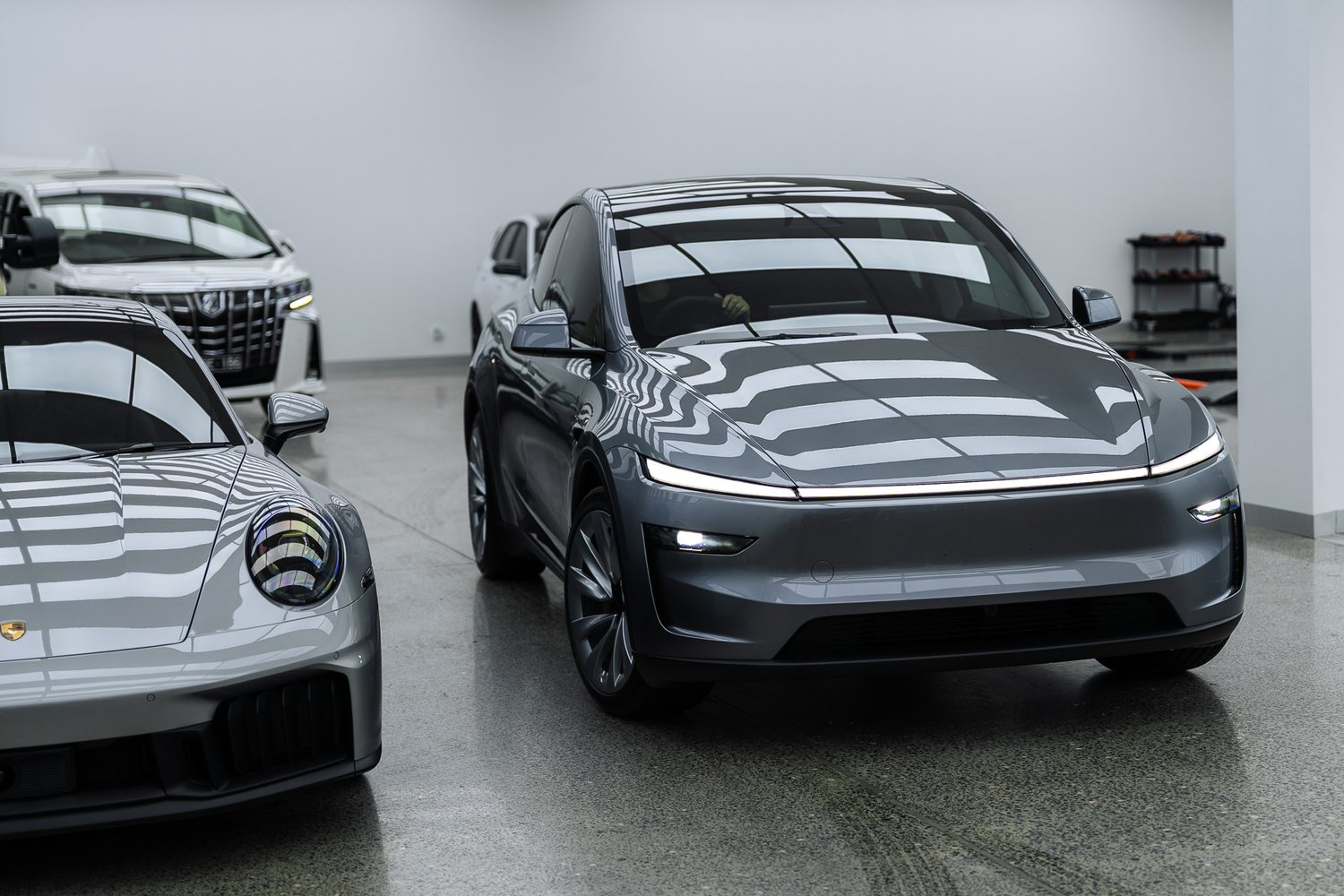 Customer cars in the Liquid R workshop