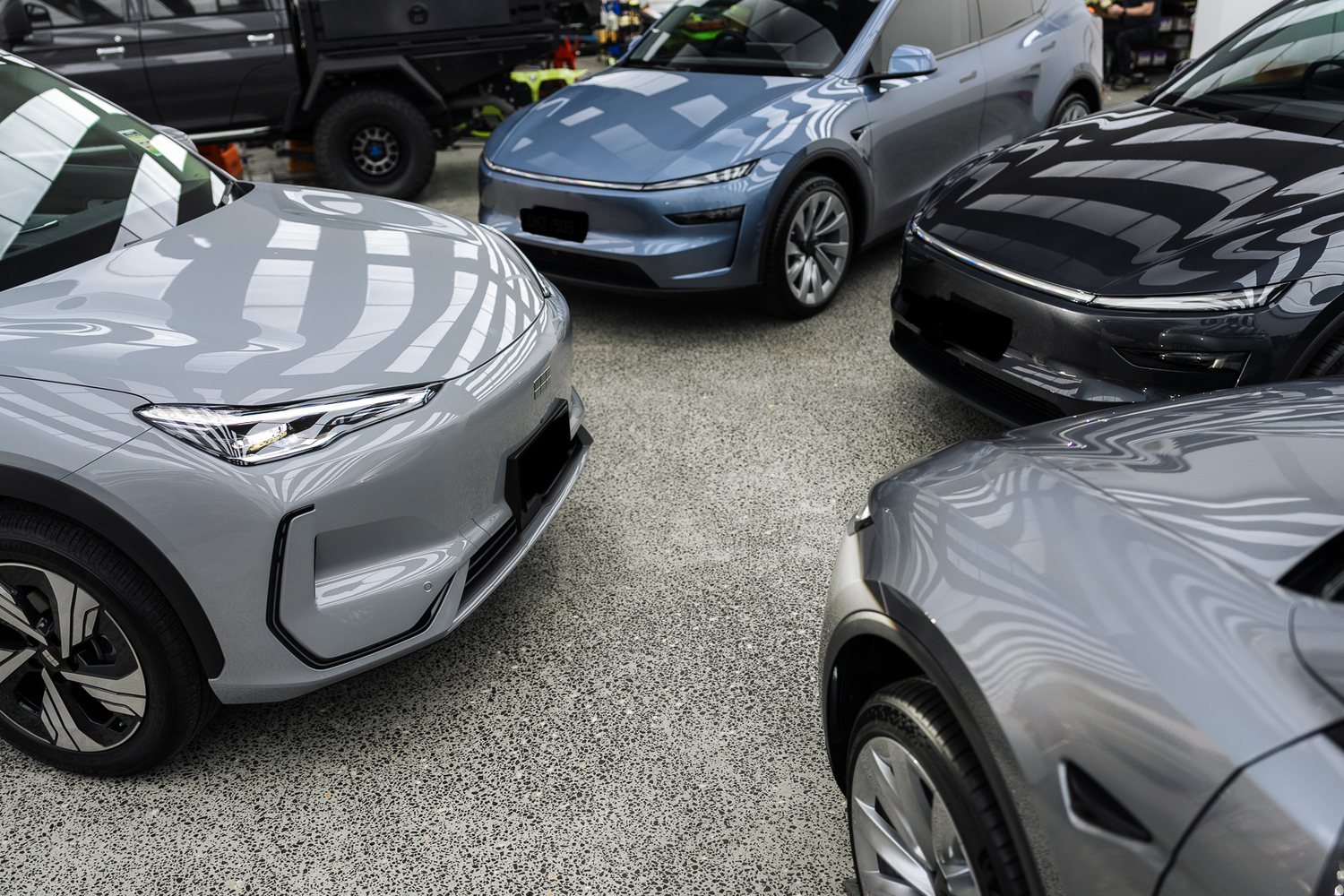 Customer cars in the Liquid R workshop