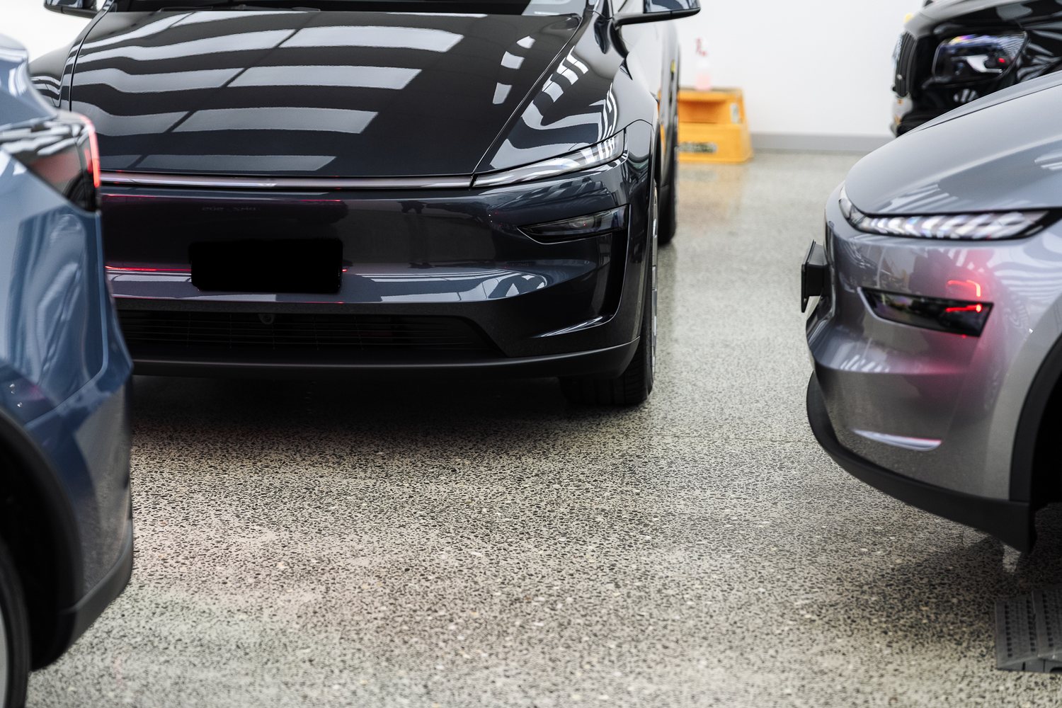 Customer cars in the Liquid R workshop