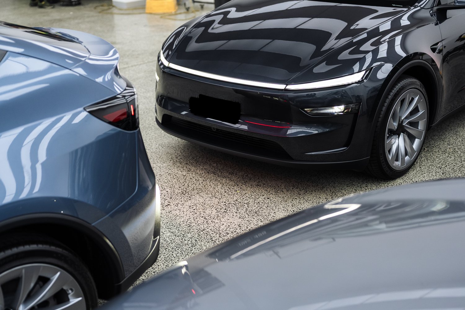 Customer cars in the Liquid R workshop
