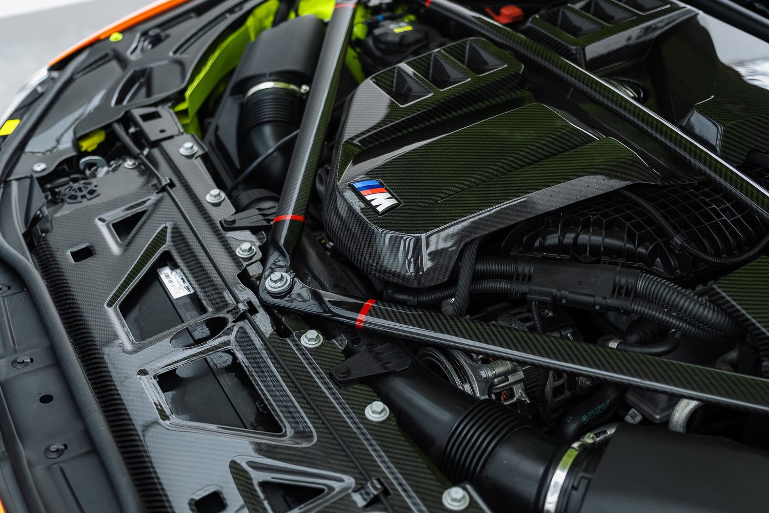 Detailing brush cleaning an engine bay