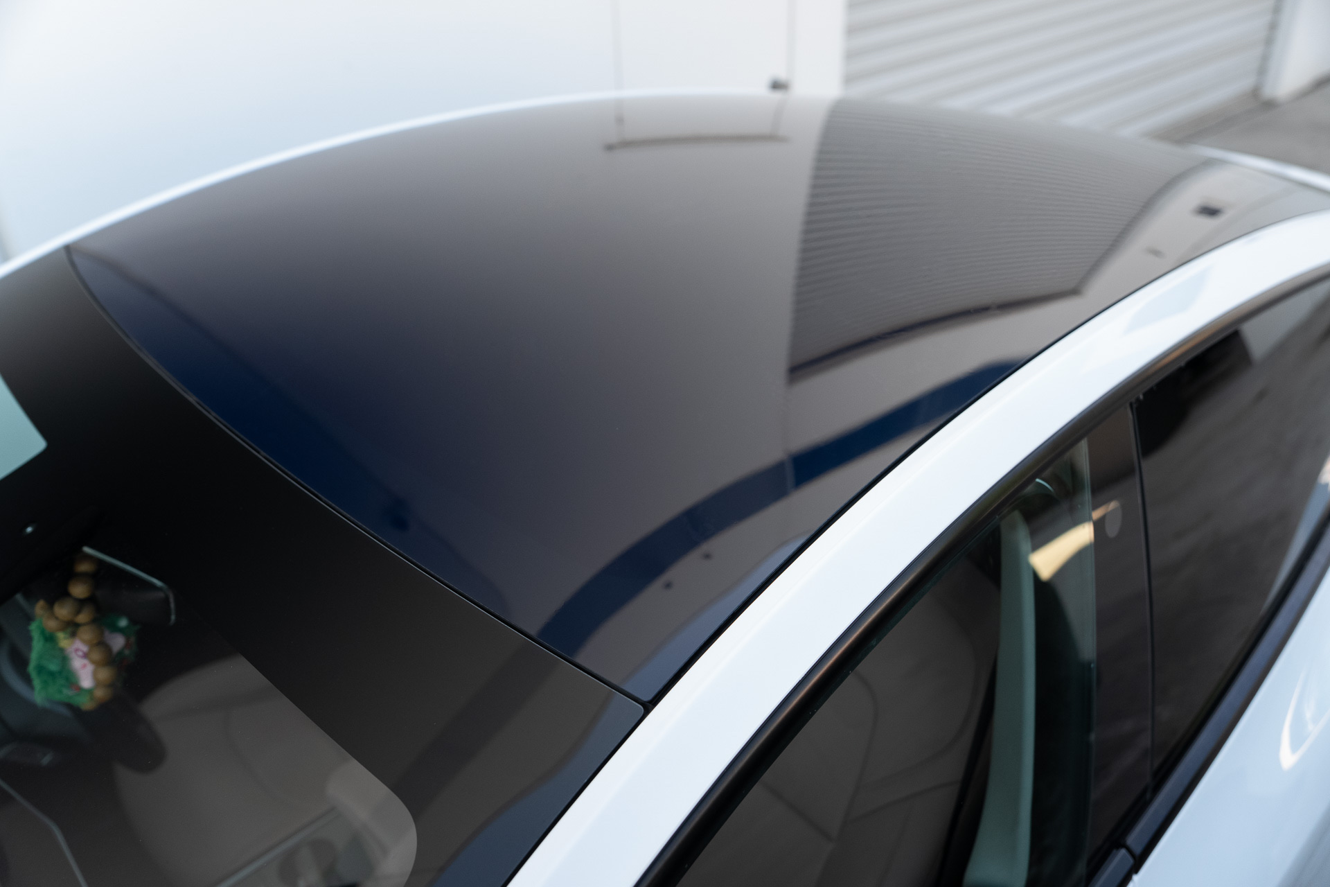 Tinted rear glass on a dark blue car