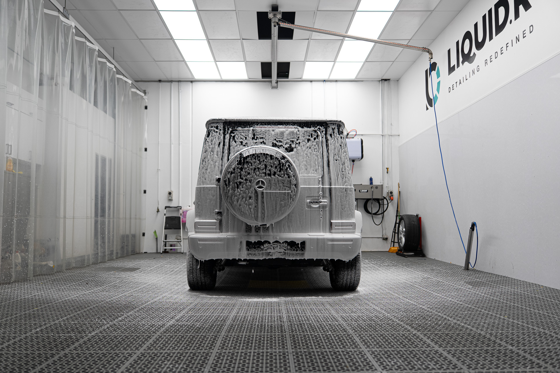 Mercedes G Wagon covered in snow foam in the Liquid R wash bay