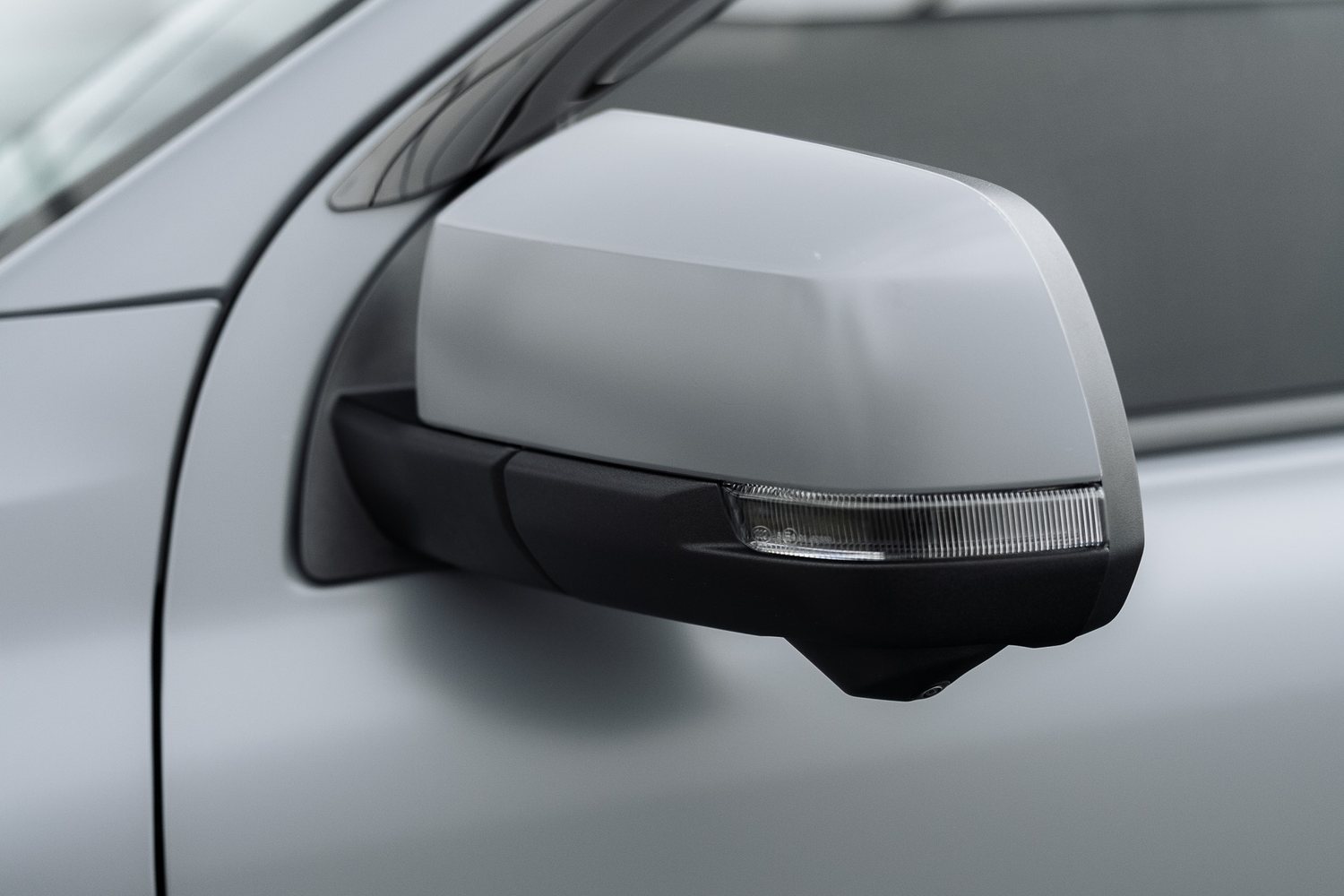 Door and mirror detail on a matte grey Ford Ranger Raptor