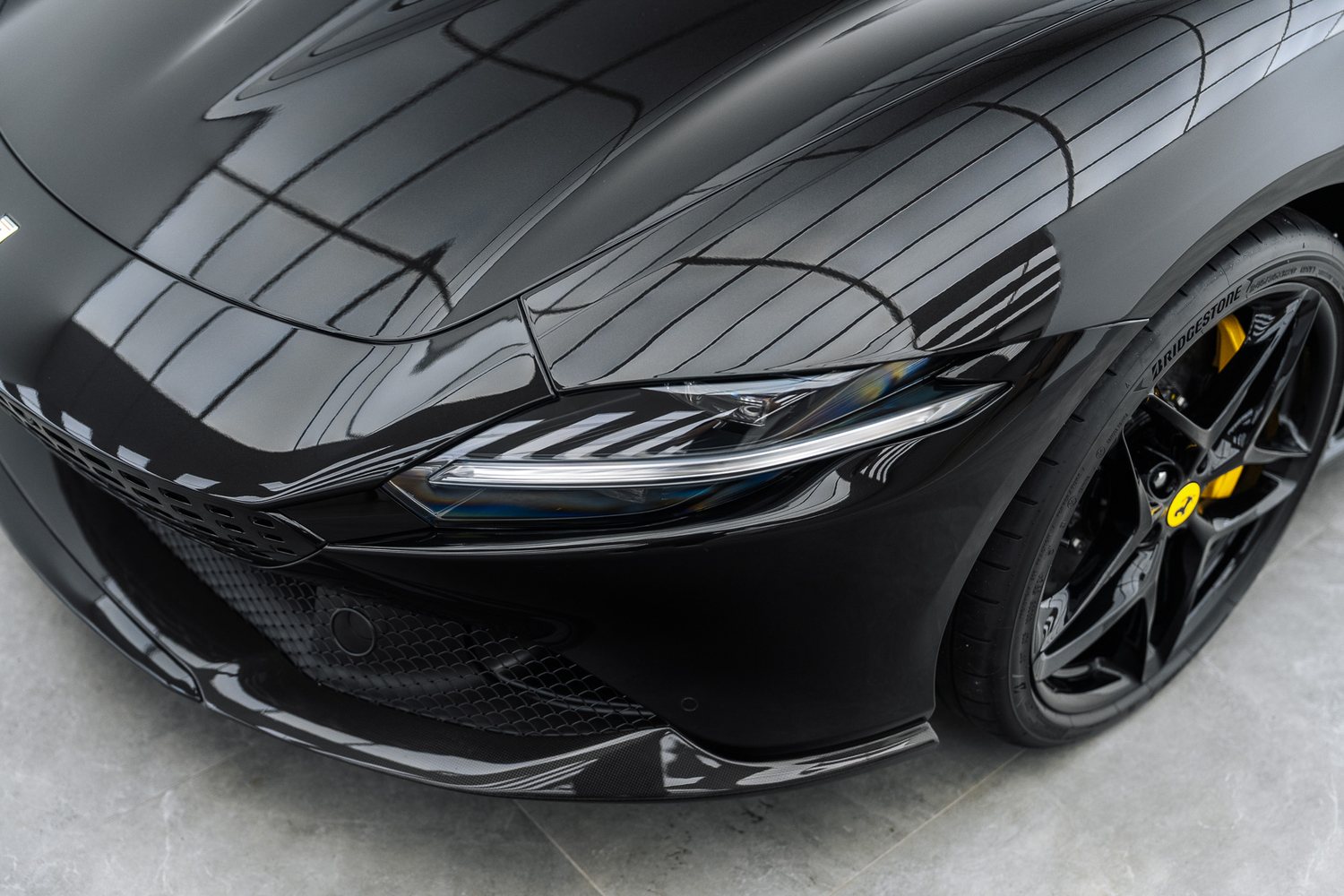Front end of a black Ferrari Roma