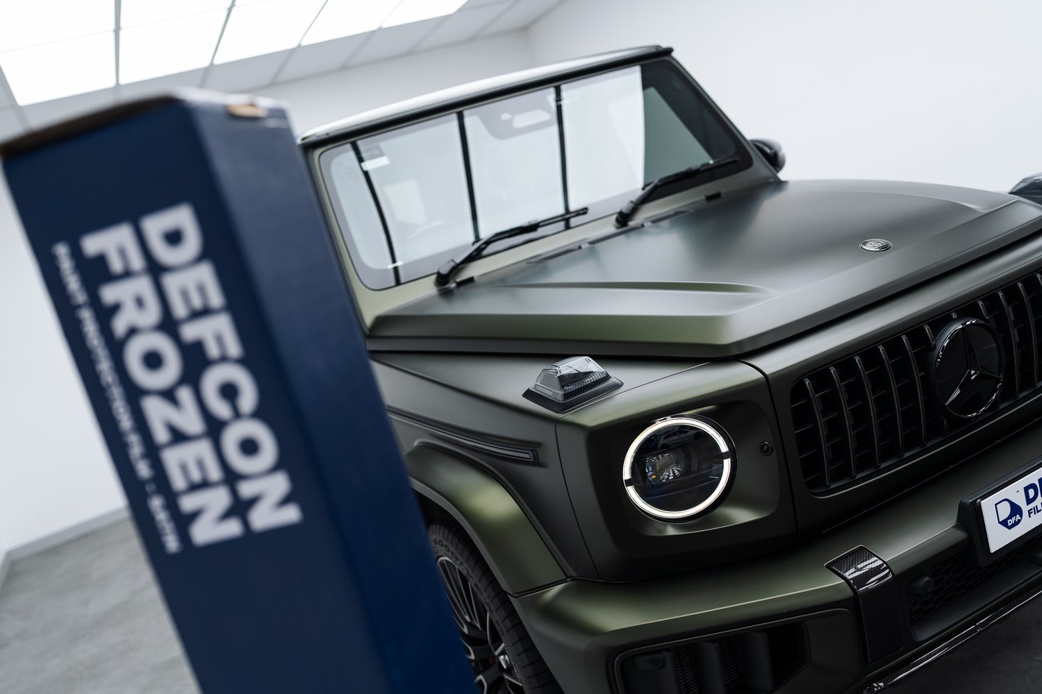 Front end of a green Mercedes G-Class in matte PPF