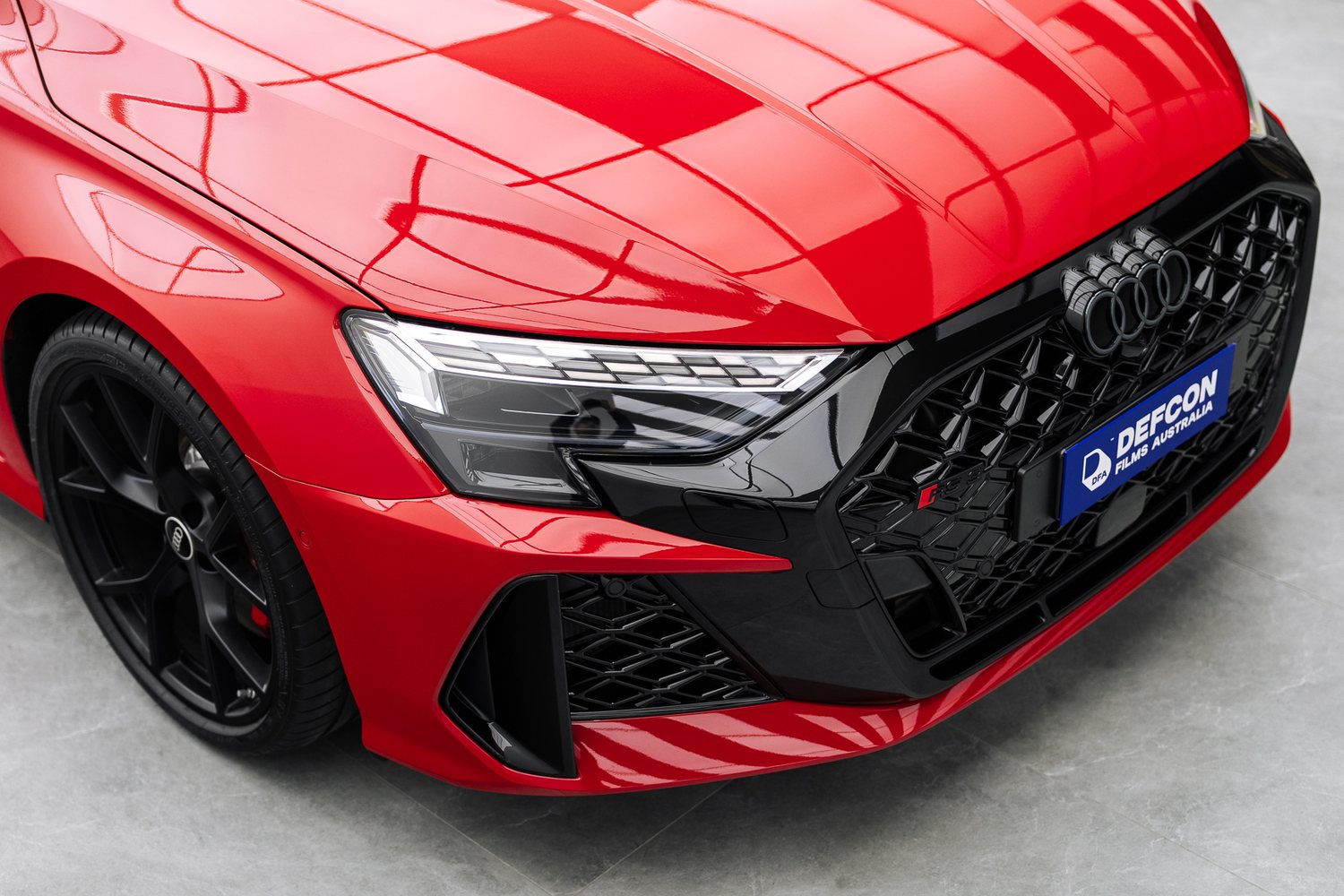 Front end of a red Audi RS3