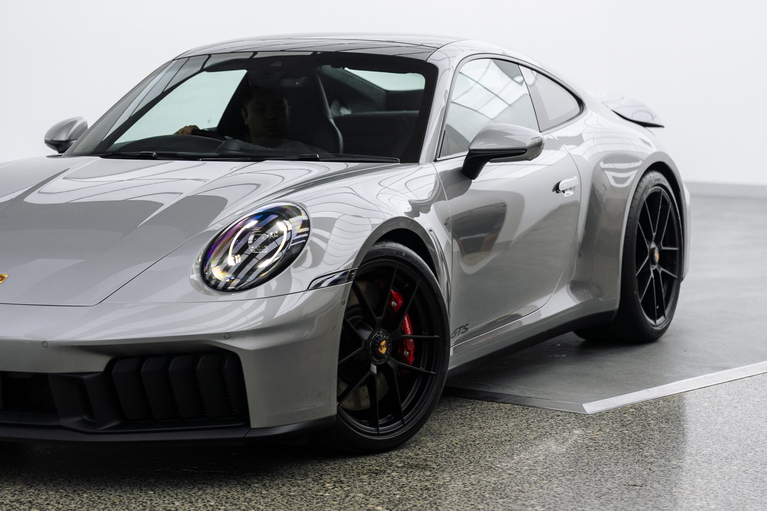 Front end of a silver Porsche 911 GTS