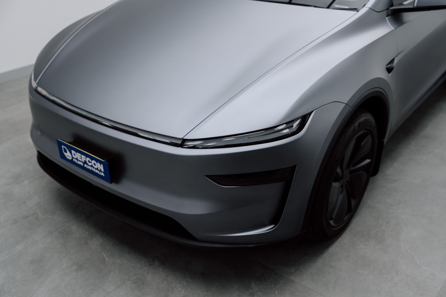 Front end of a Tesla Model Y in matte PPF