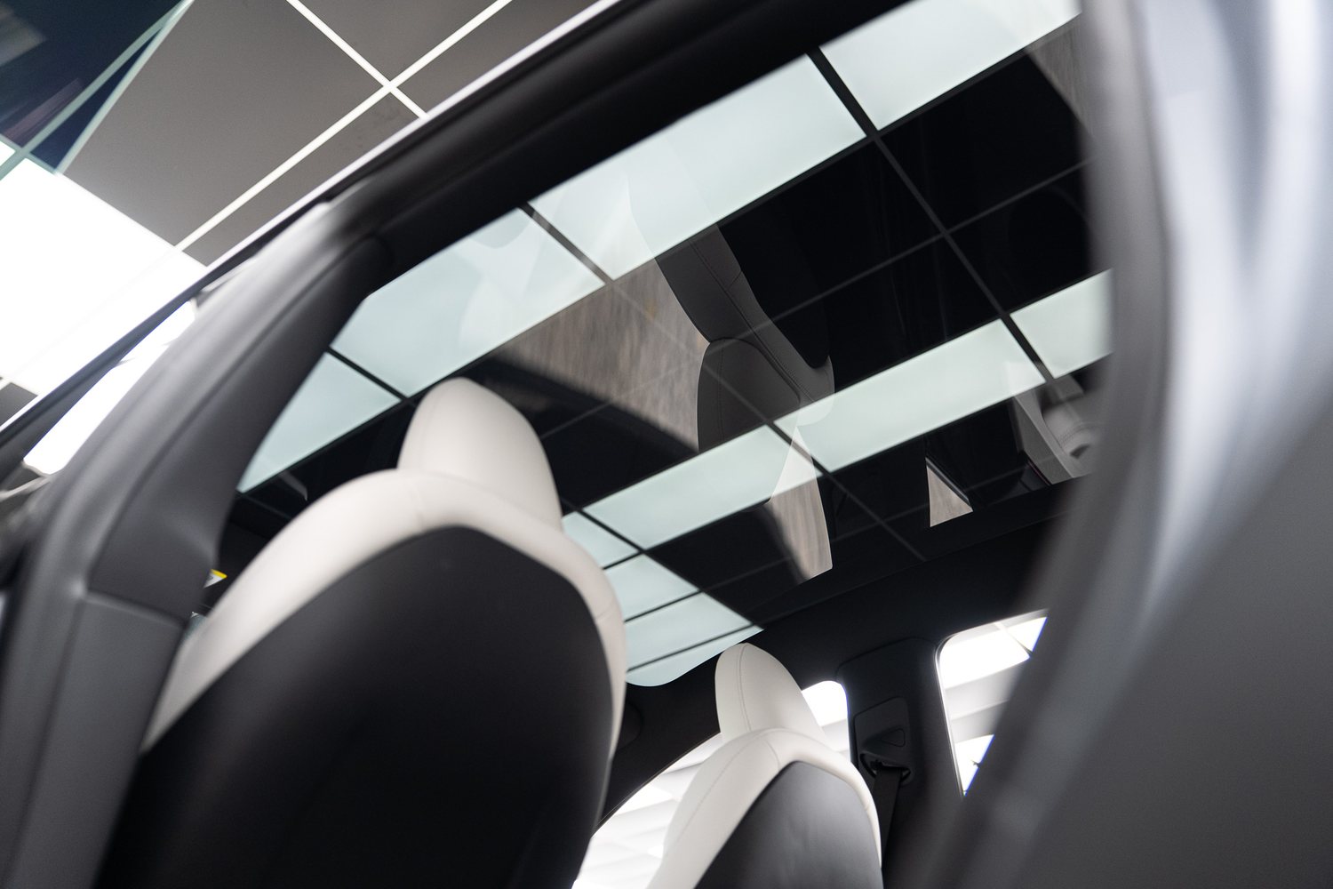 Glass roof seen from inside a Tesla
