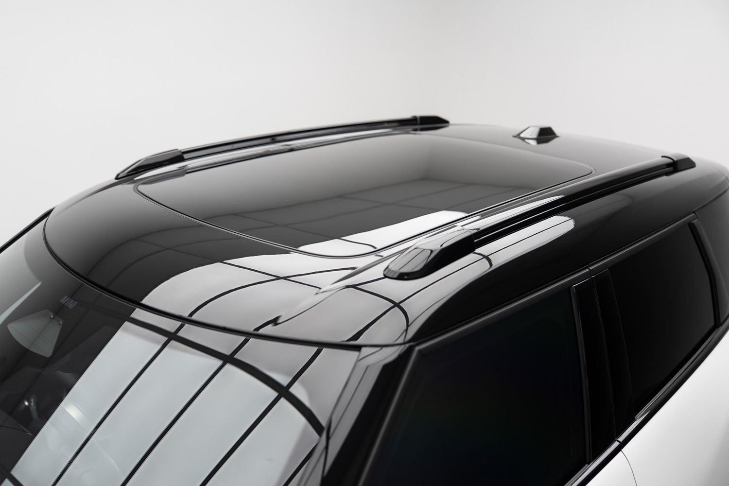 Gloss black roof on a white SUV