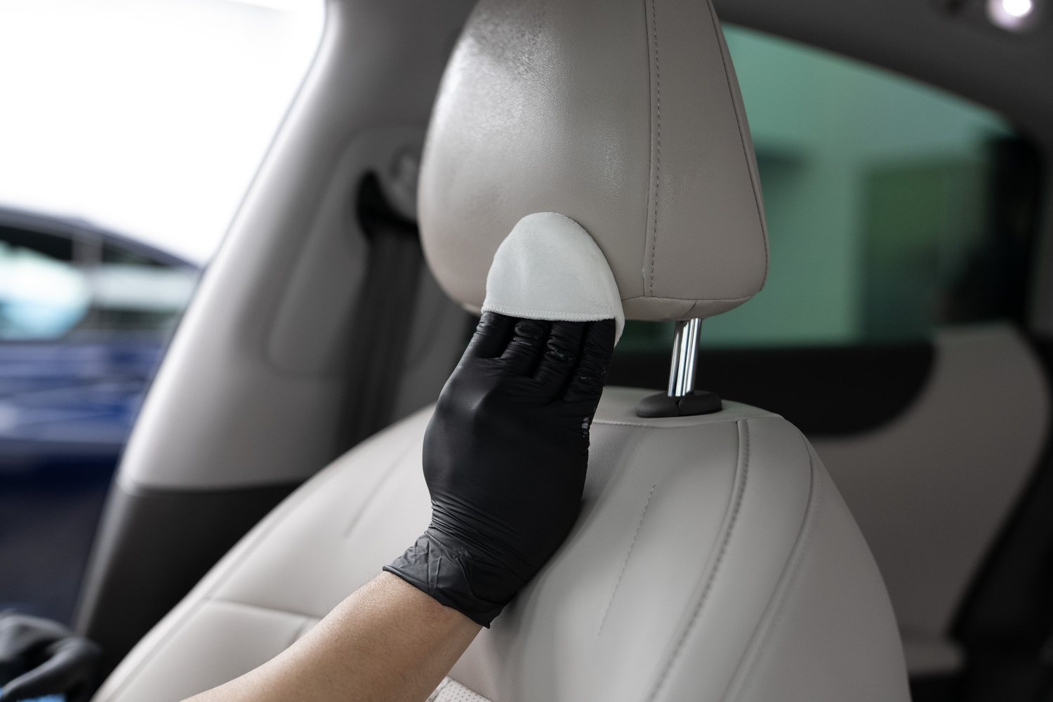 Leather protection being applied to a cream seat