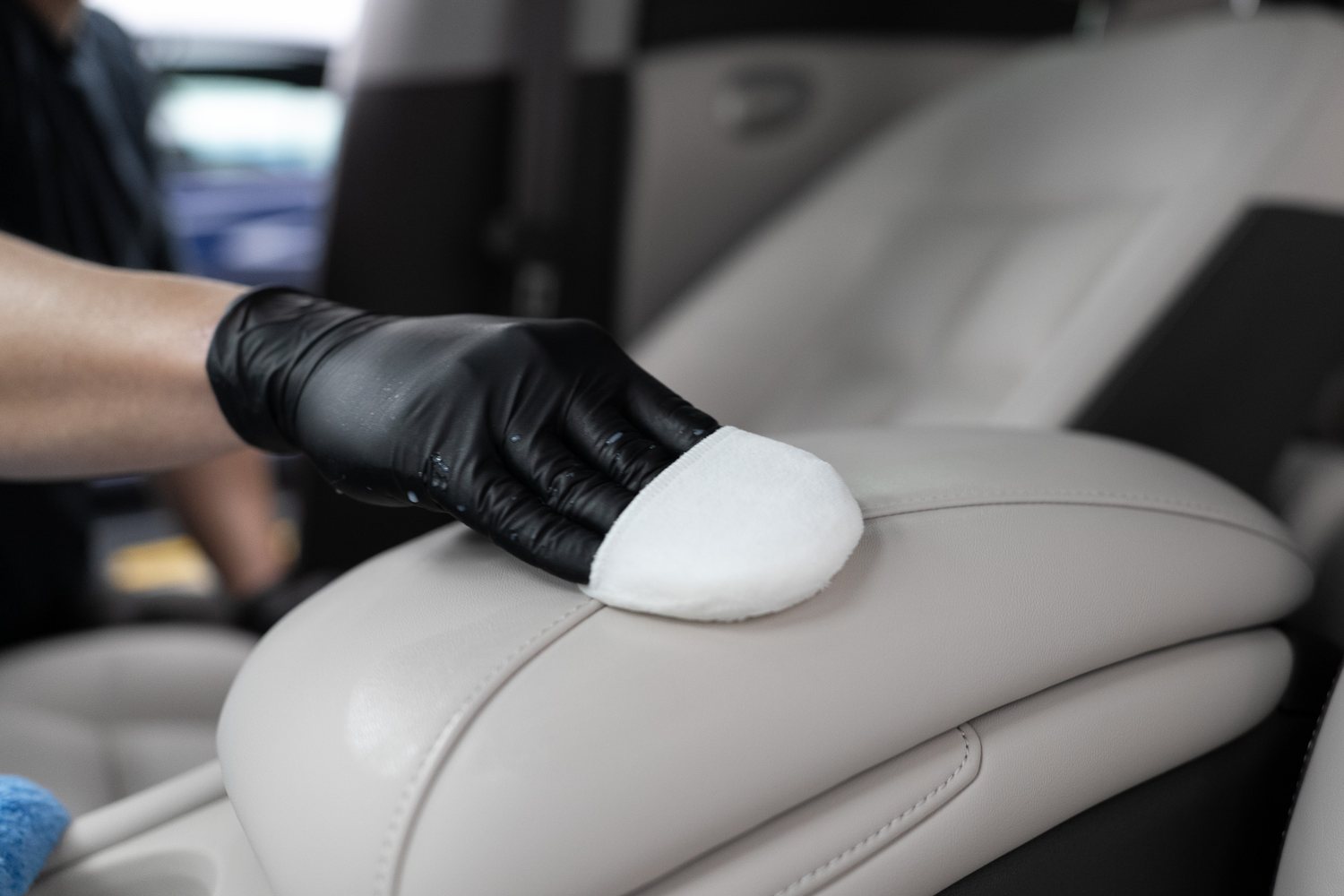Leather protection being applied to a cream seat