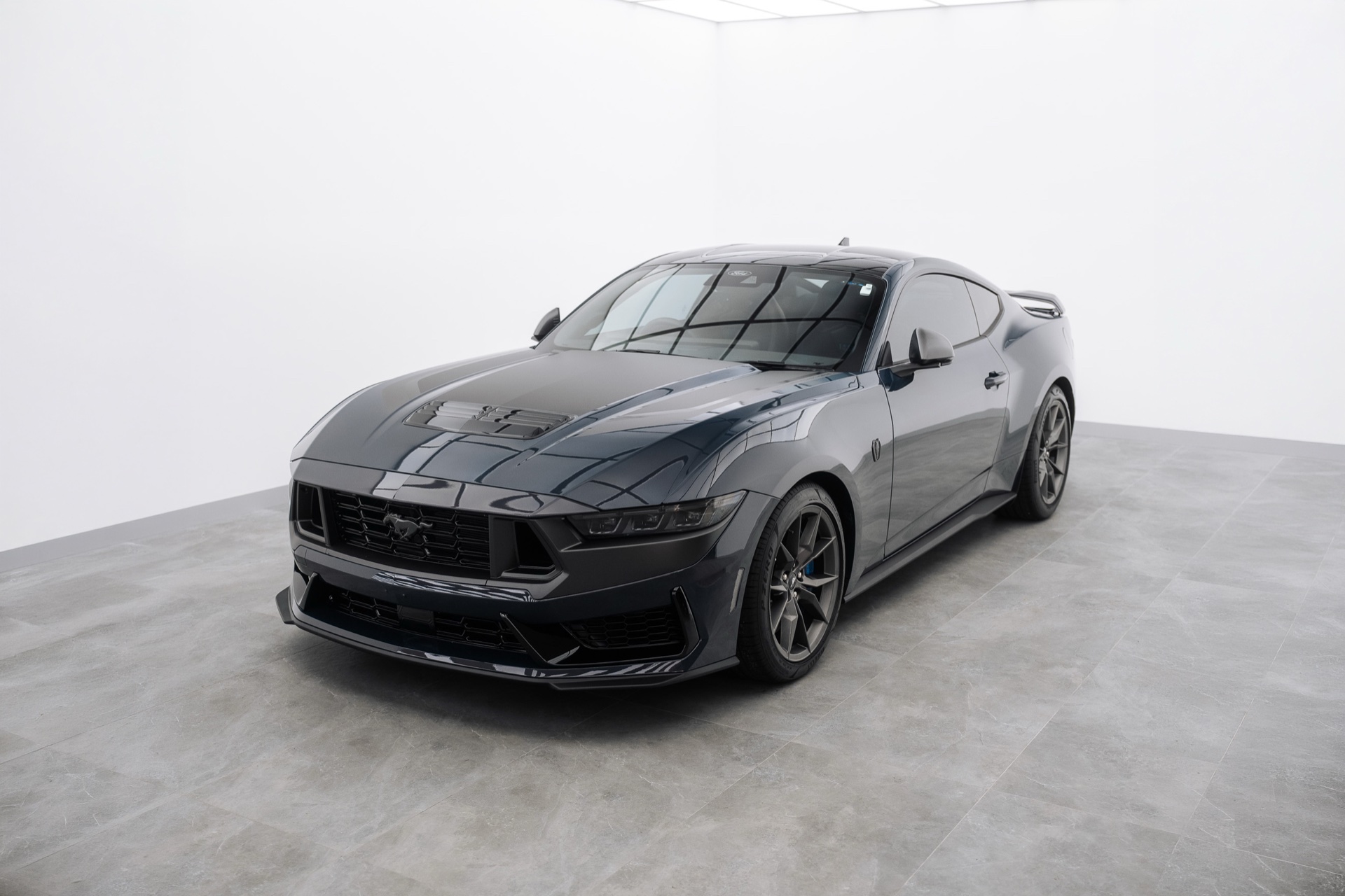 Dark grey Ford Mustang in the Liquid R studio