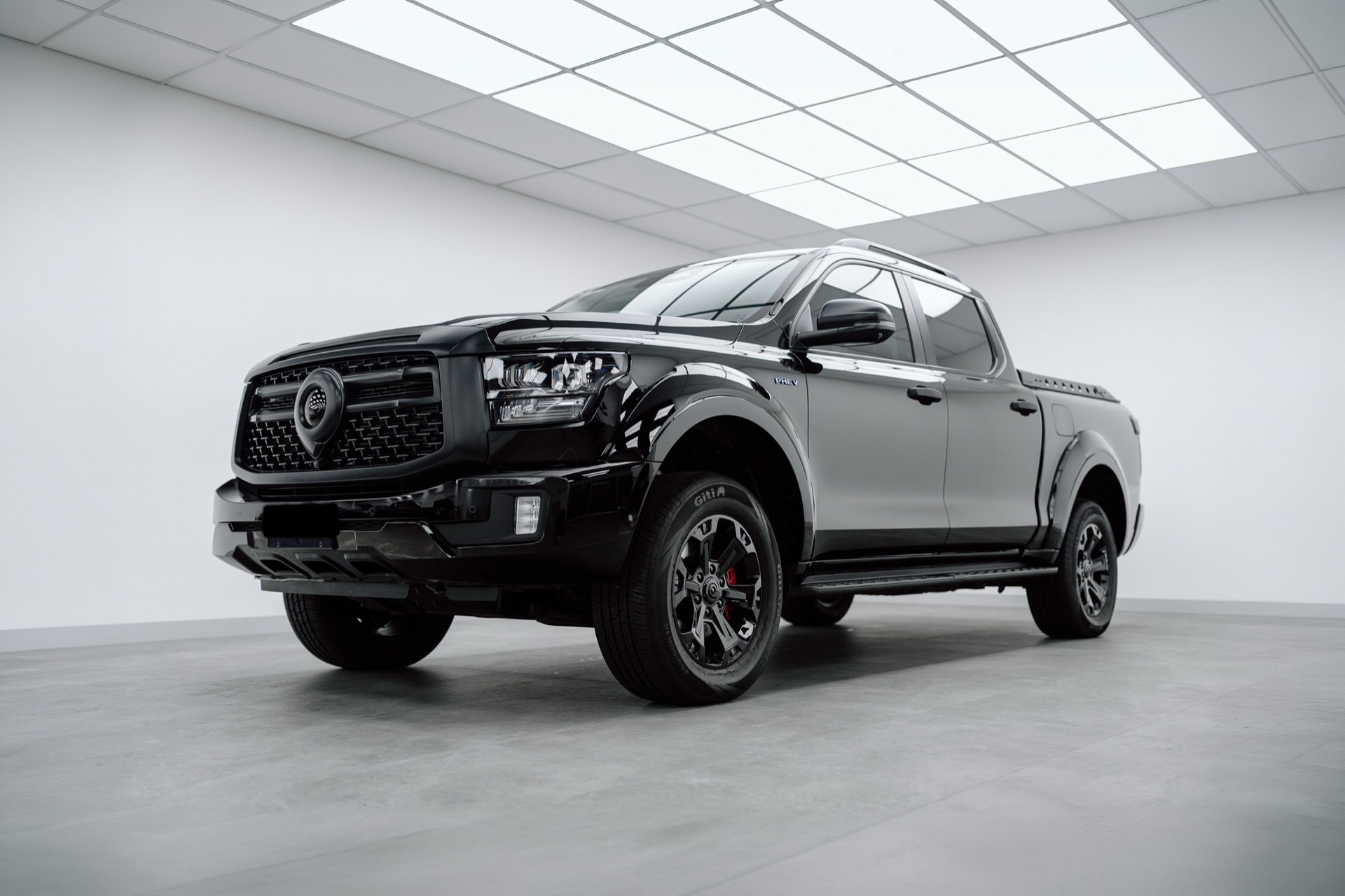 Black GWM Cannon ute in the Liquid R studio