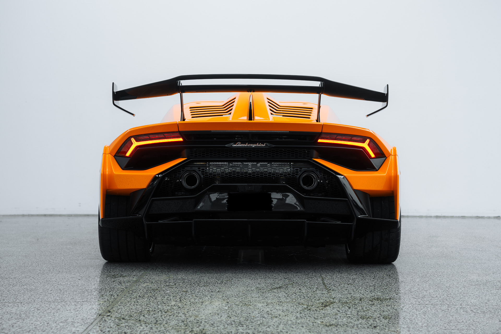 Orange Lamborghini Huracan rear view