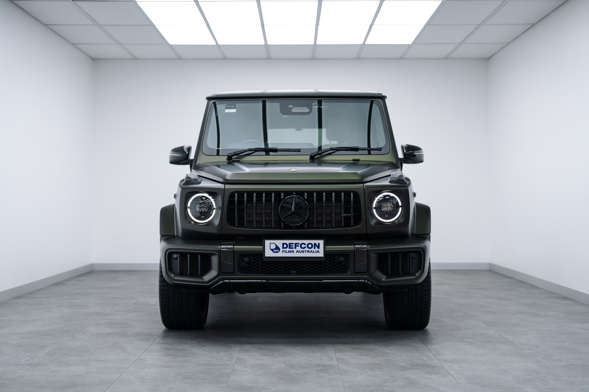 Mercedes AMG G63 front view with Defcon Films Australia film roll