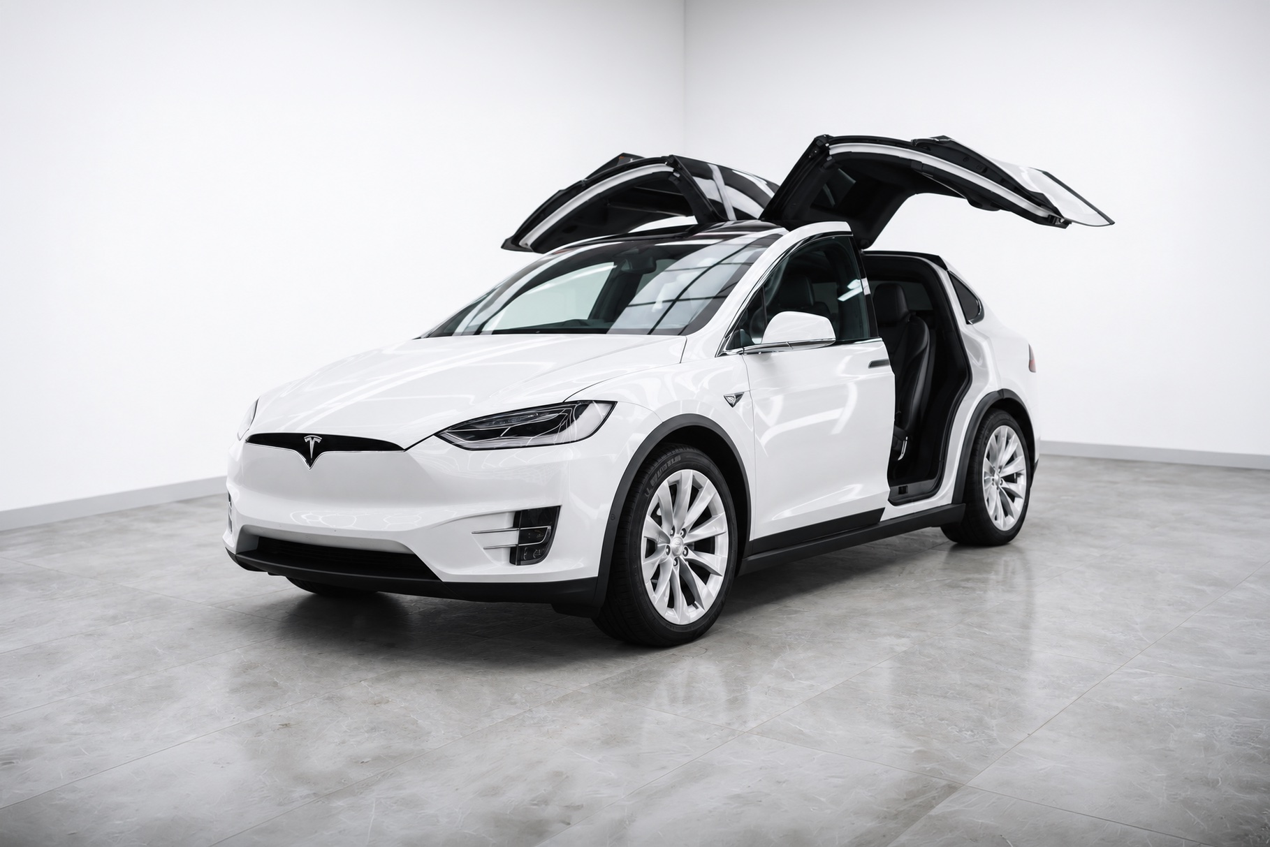White Tesla Model X with falcon doors open
