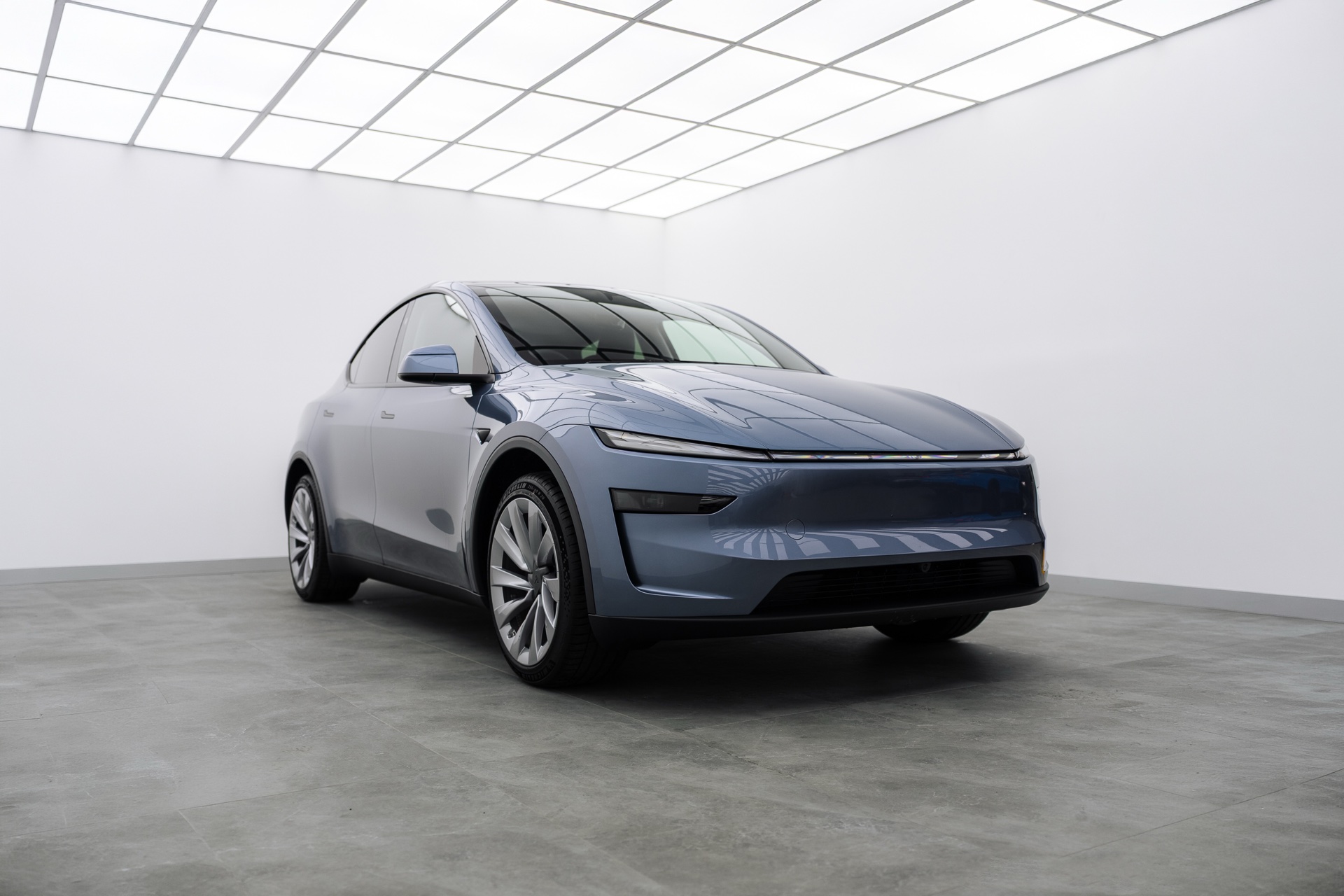 Grey Tesla Model Y in the Liquid R studio