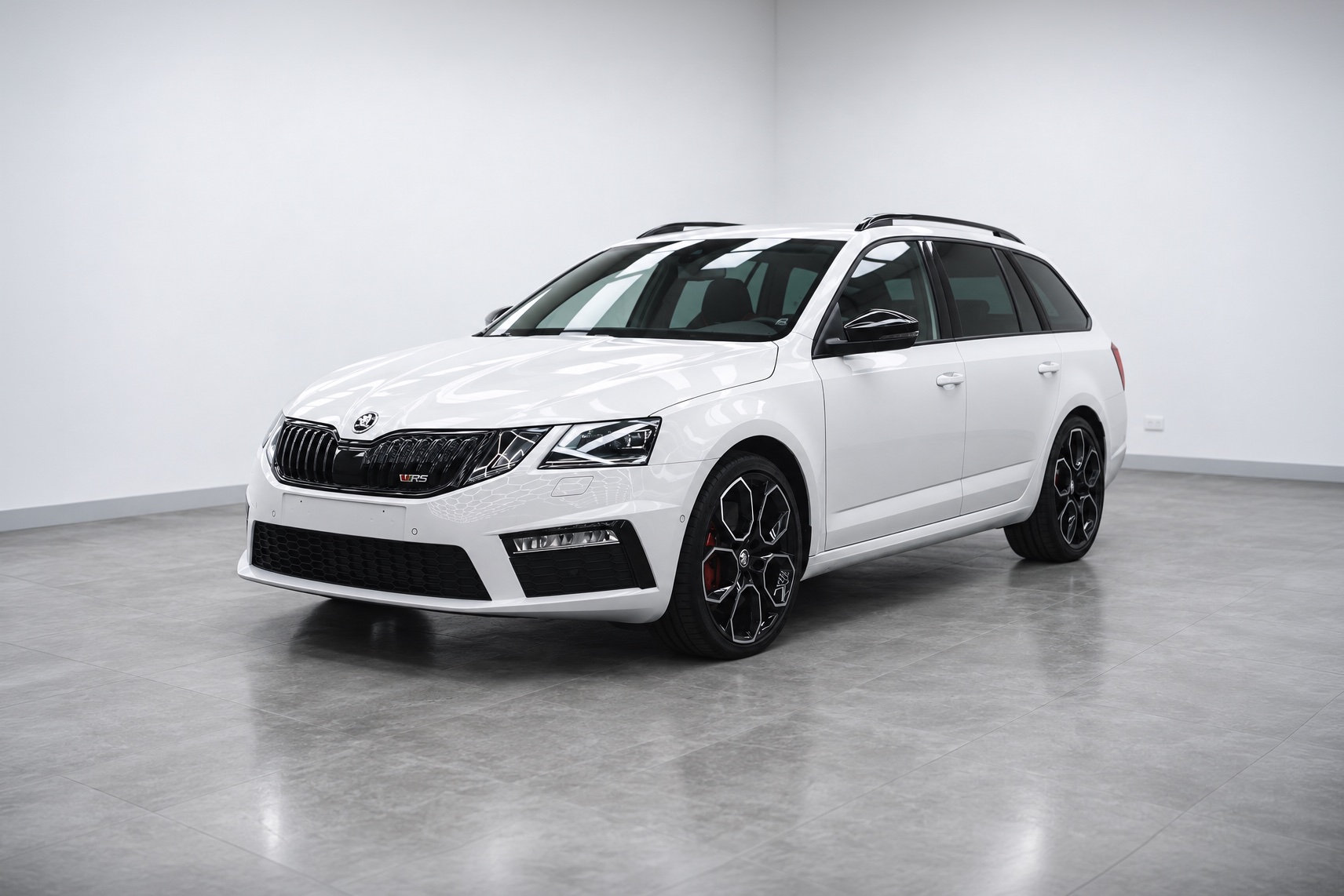 White Skoda Octavia RS wagon in the Liquid R studio