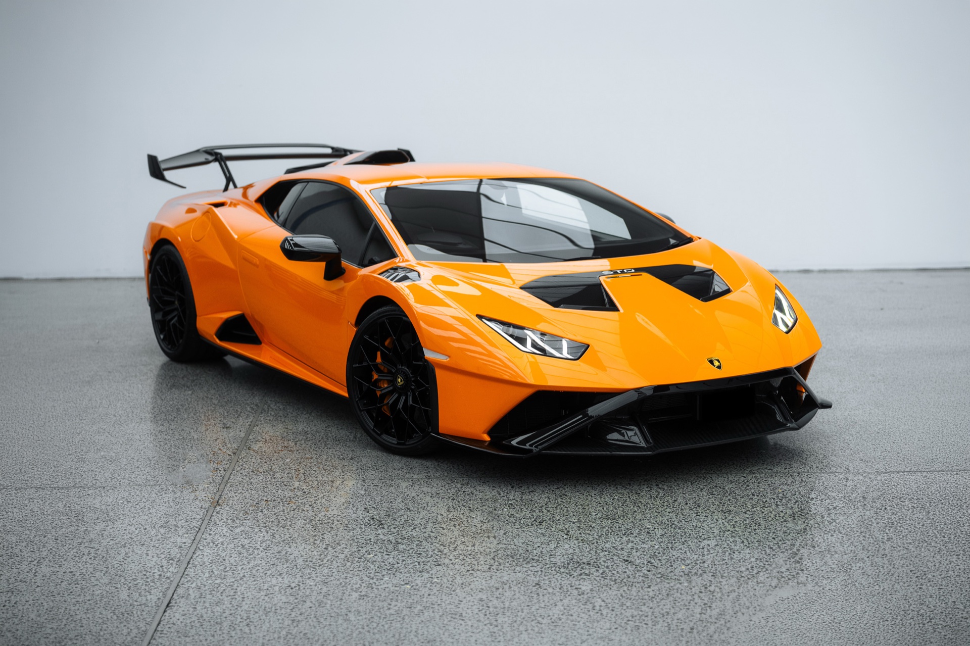 Orange Lamborghini Huracan STO in the Liquid R studio