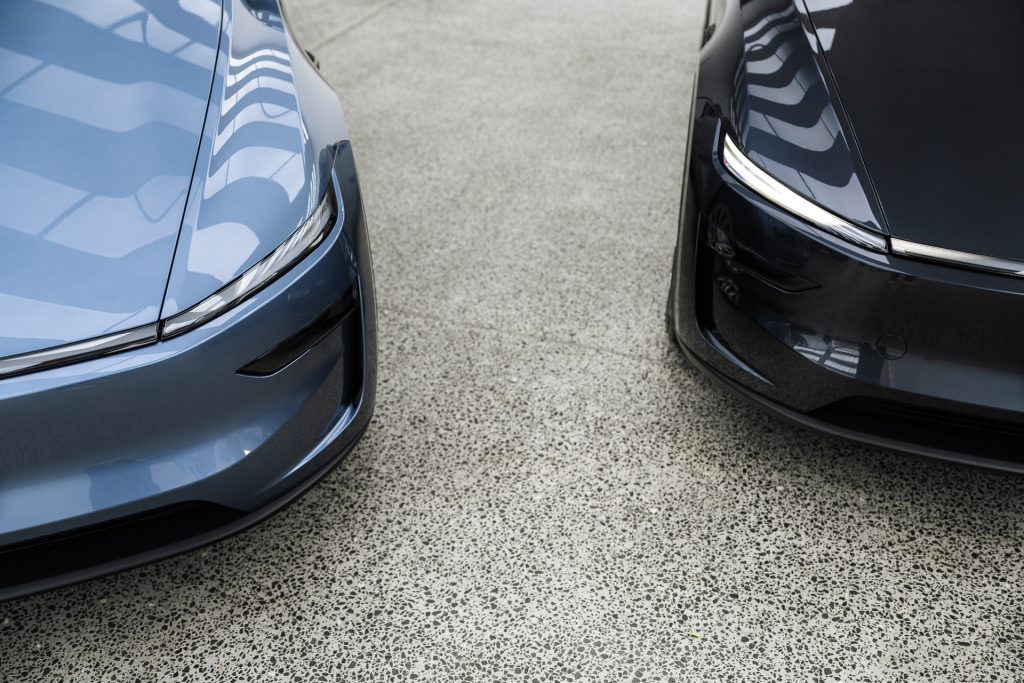 Front corners of two Teslas in the Liquid R workshop