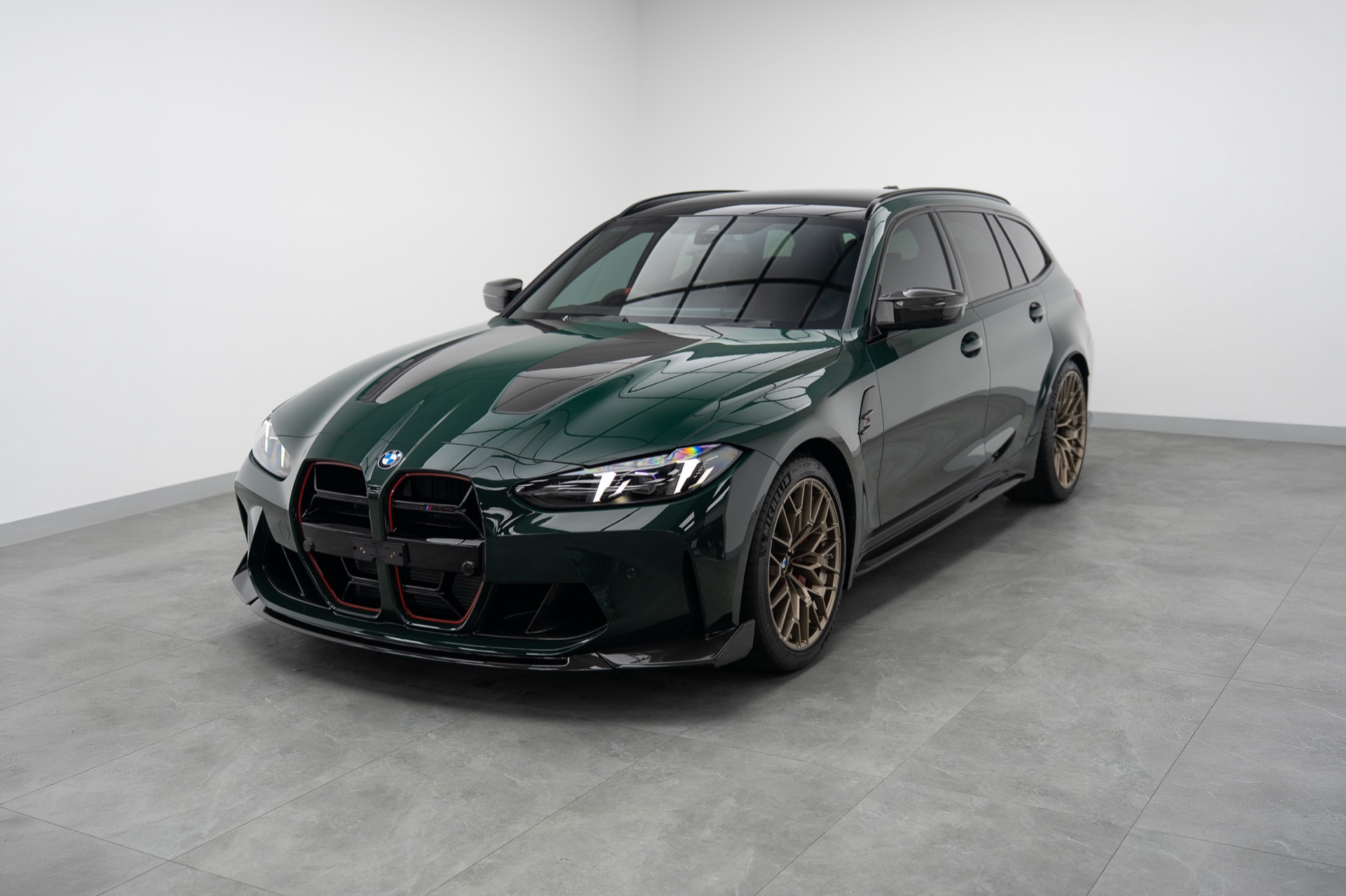 Green BMW M3 Touring wagon in the Liquid R studio