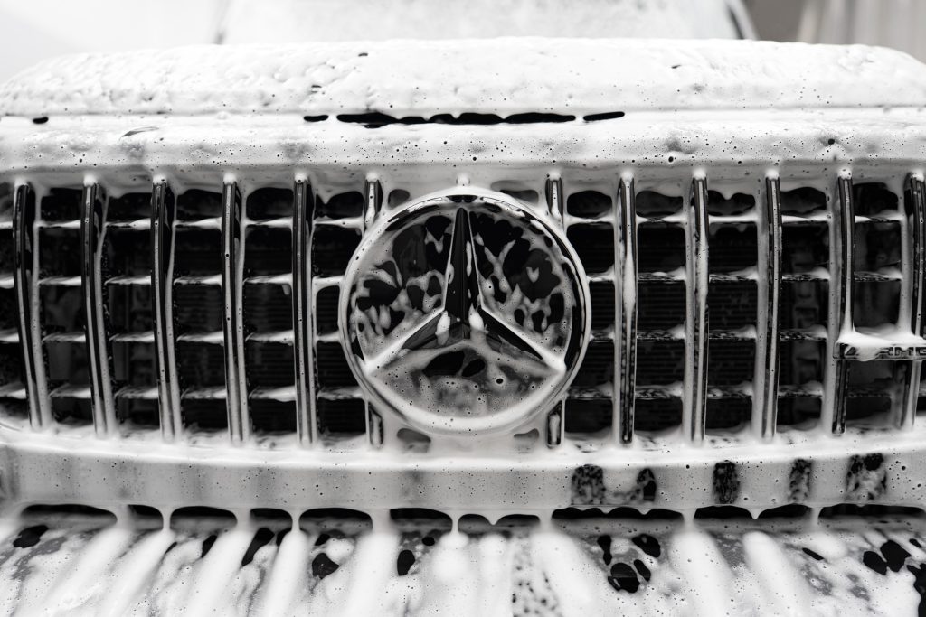 Mercedes grille covered in snow foam