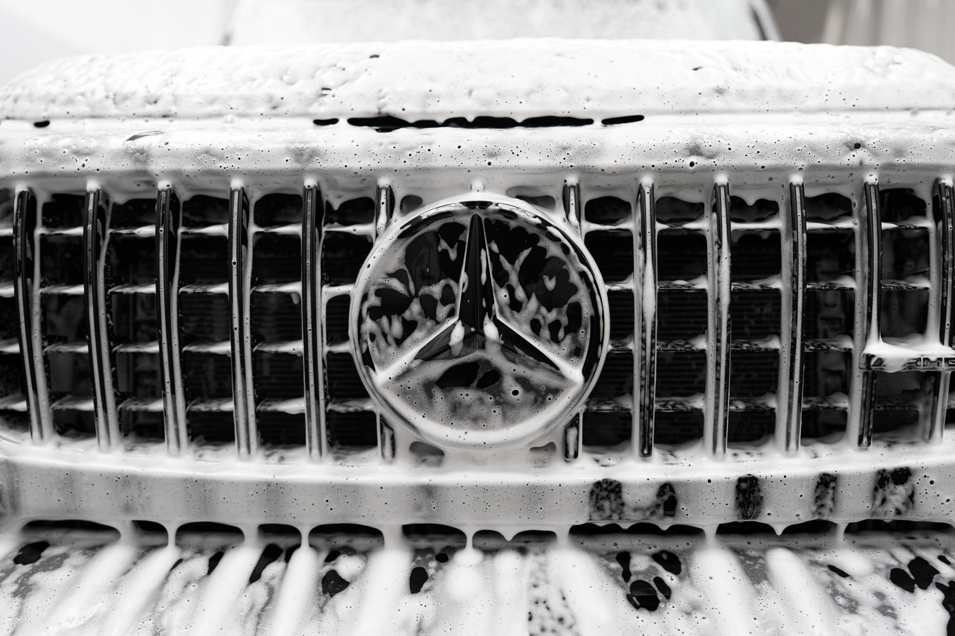 Mercedes grille covered in snow foam