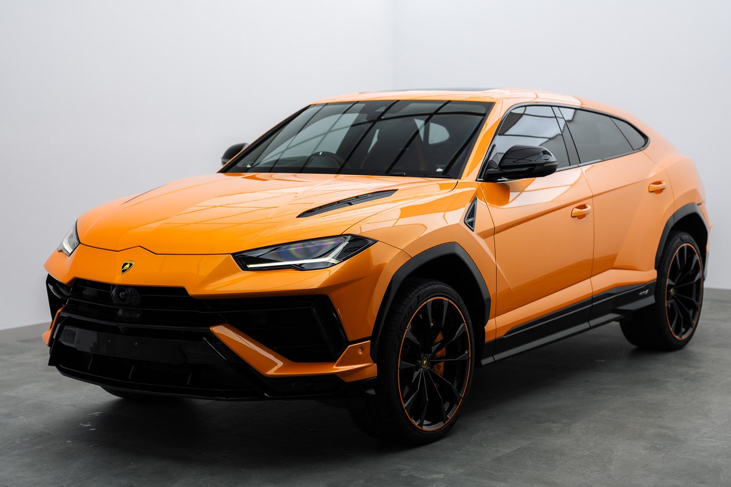 Orange Lamborghini Urus in the Liquid R studio