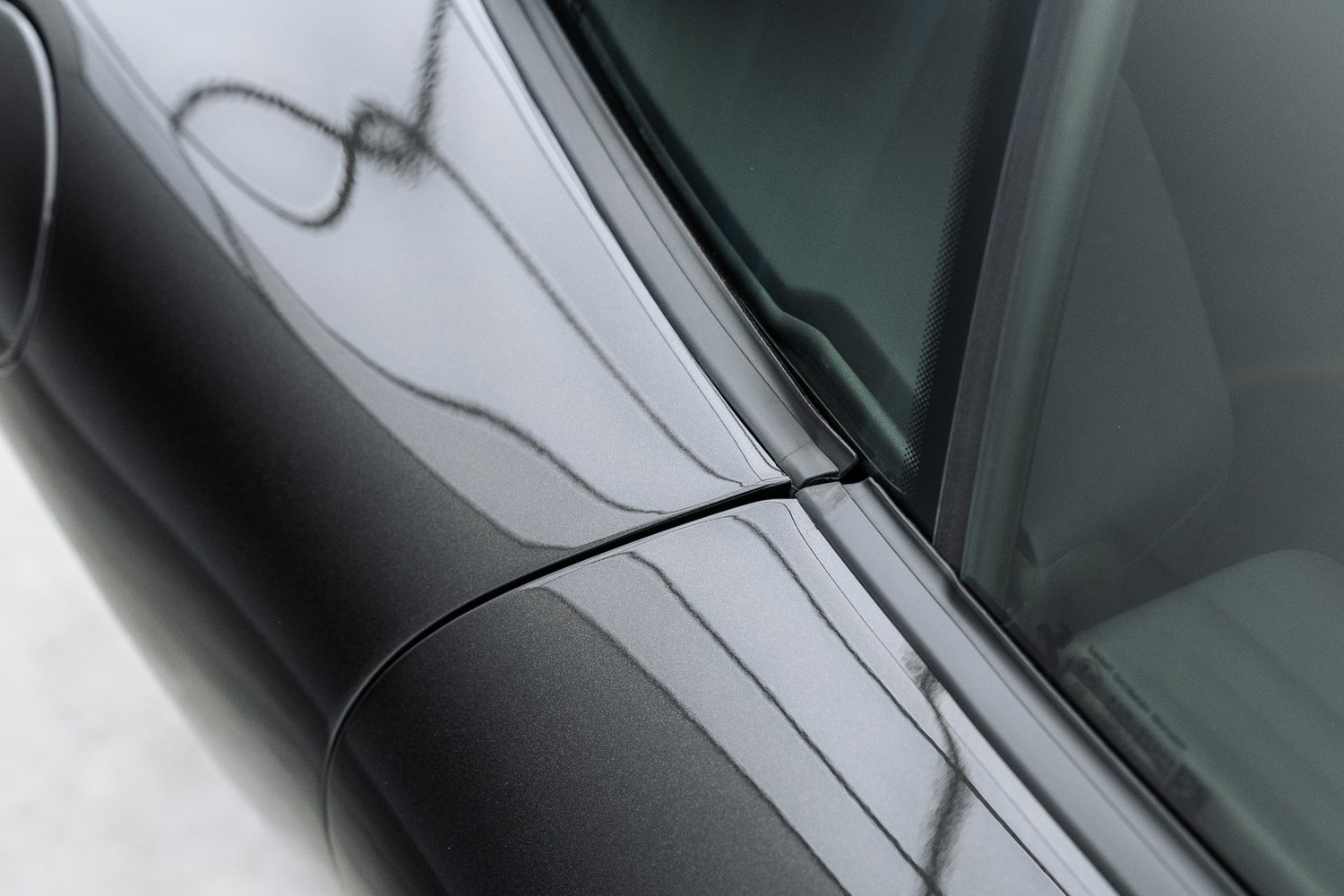 Paintwork detail on a black Ferrari Roma