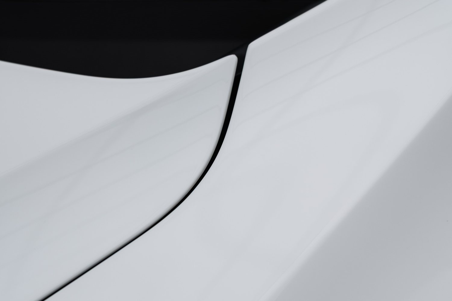 Paintwork detail on a white Chevrolet Corvette