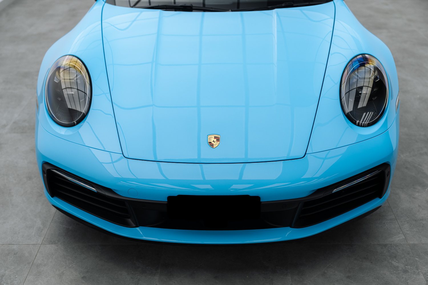 Porsche 911 in blue colour film in the Liquid R studio