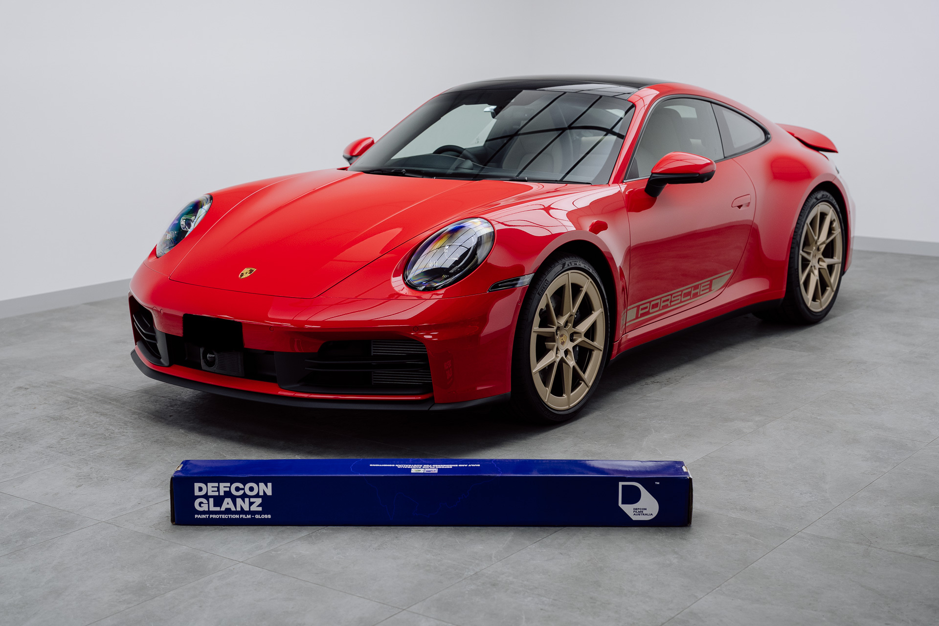 Red Porsche 911 with Defcon Glanz PPF roll