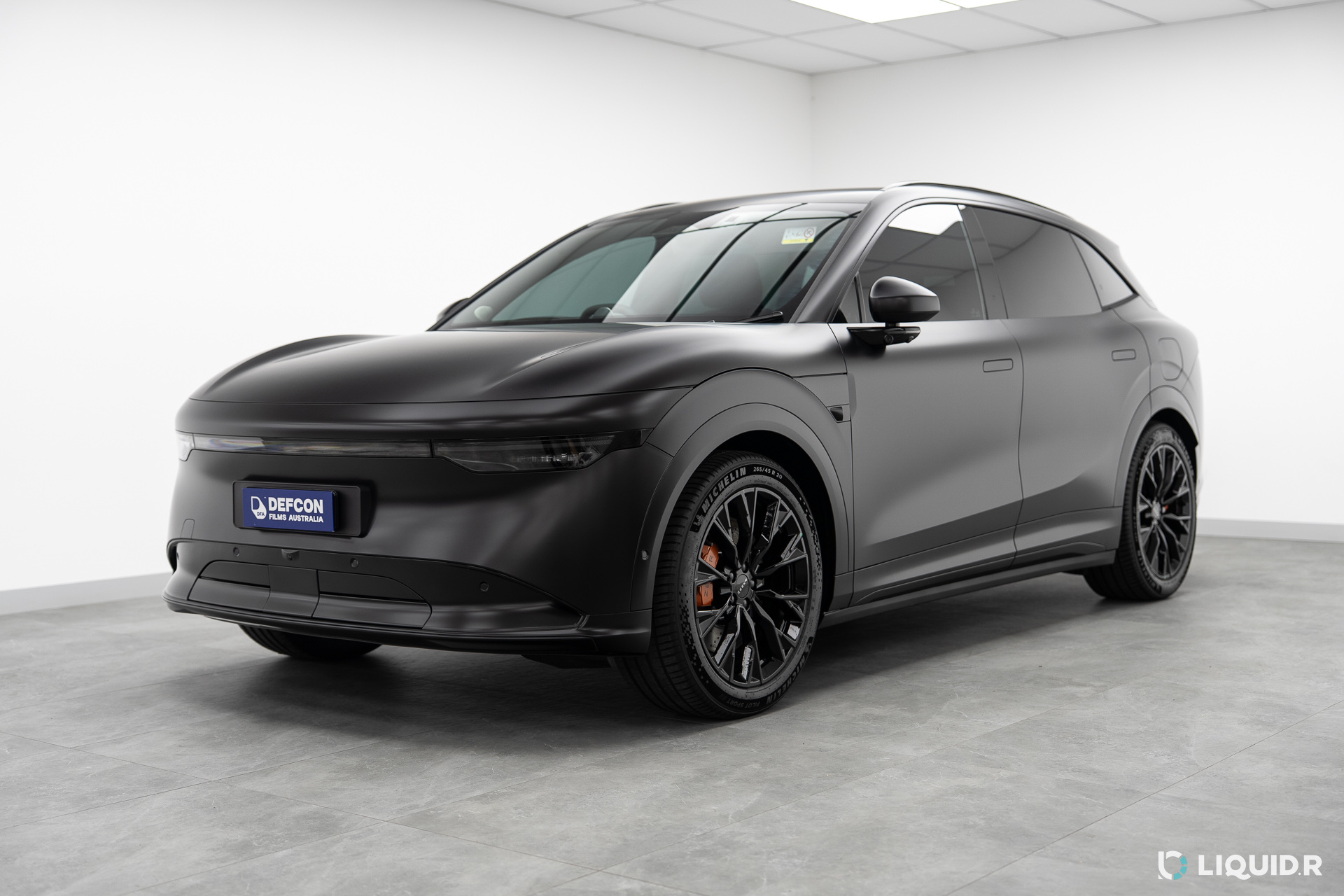 Satin black Lamborghini Urus with Defcon film roll