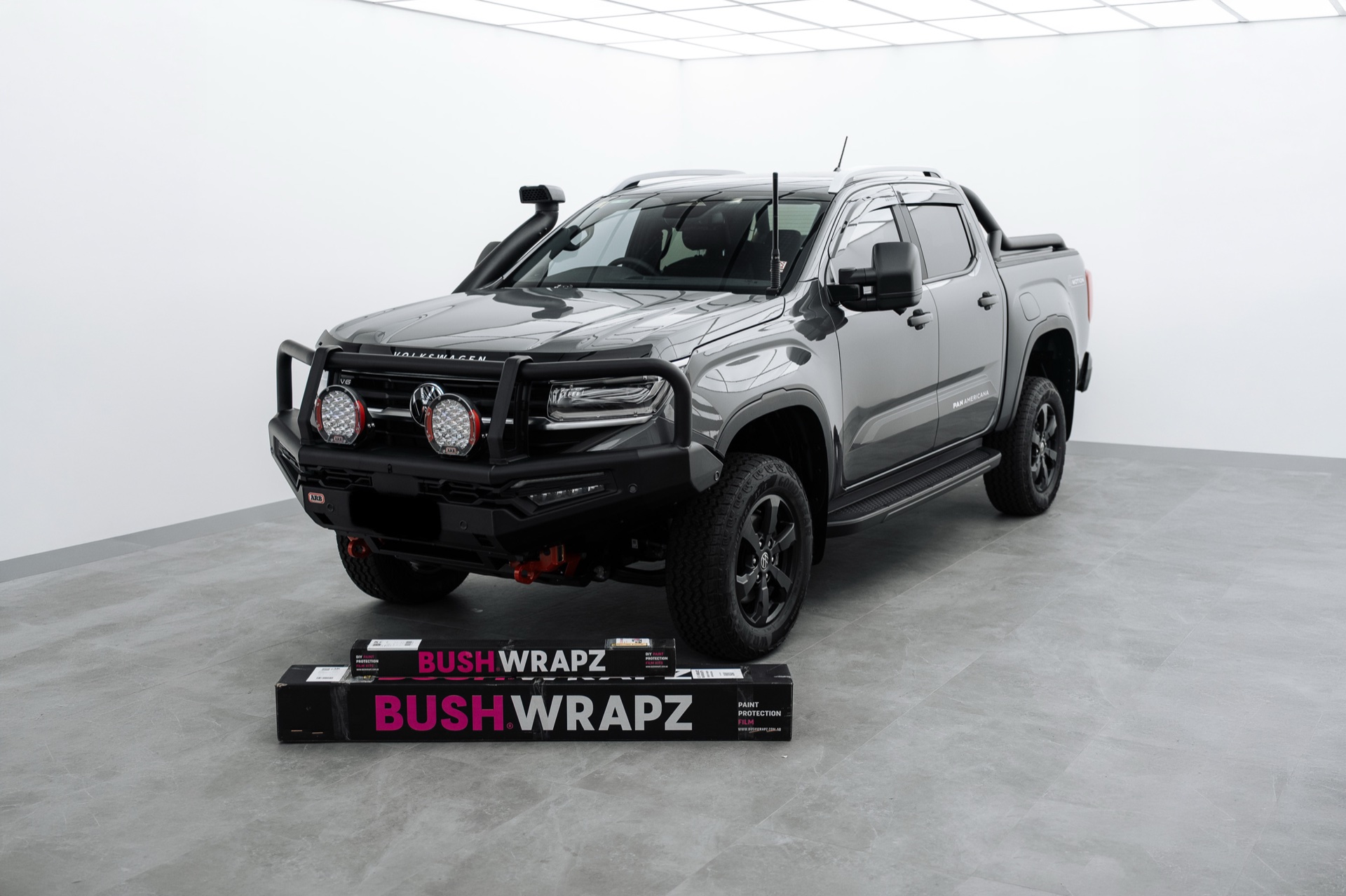 Grey Nissan Navara ute on a Bushwrapz display