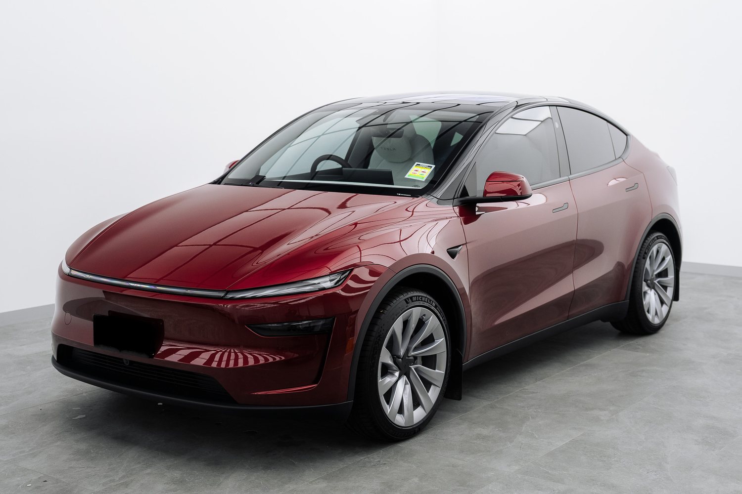 Red Tesla Model Y in the Liquid R studio
