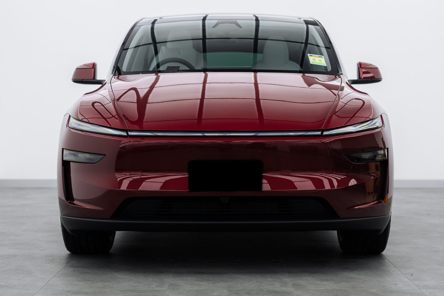 Red Tesla Model Y in the Liquid R studio