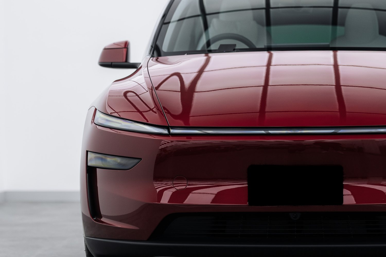 Red Tesla Model Y in the Liquid R studio