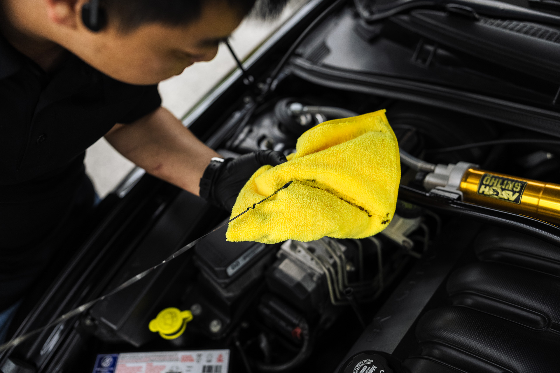 Mechanic servicing an engine bay