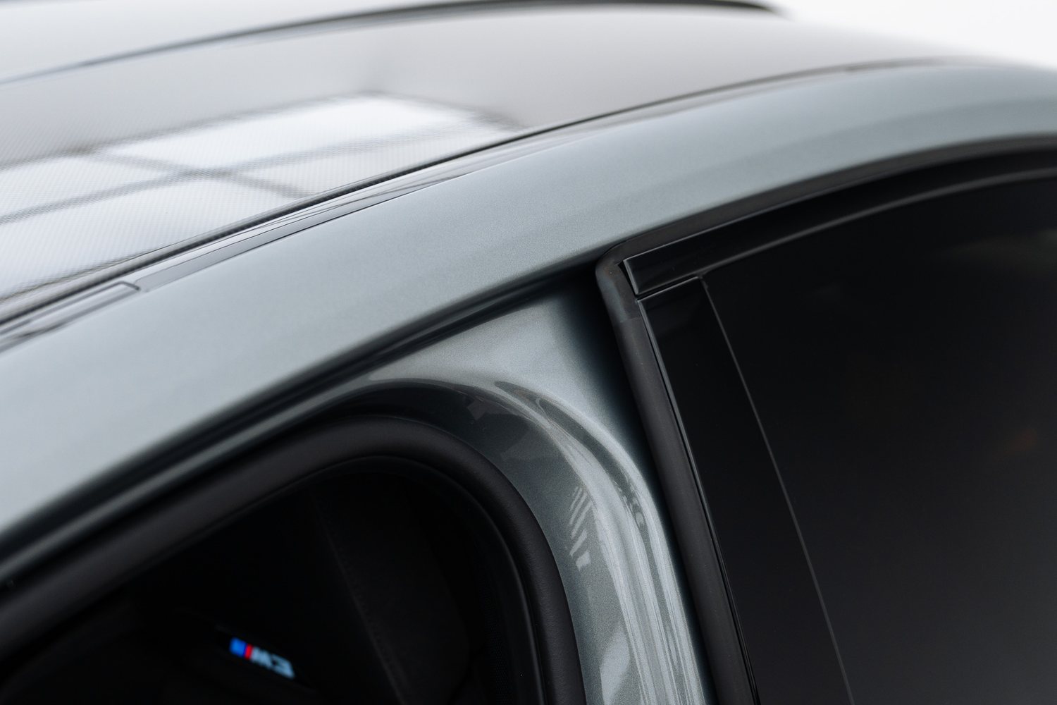 Side glass of a silver BMW M3