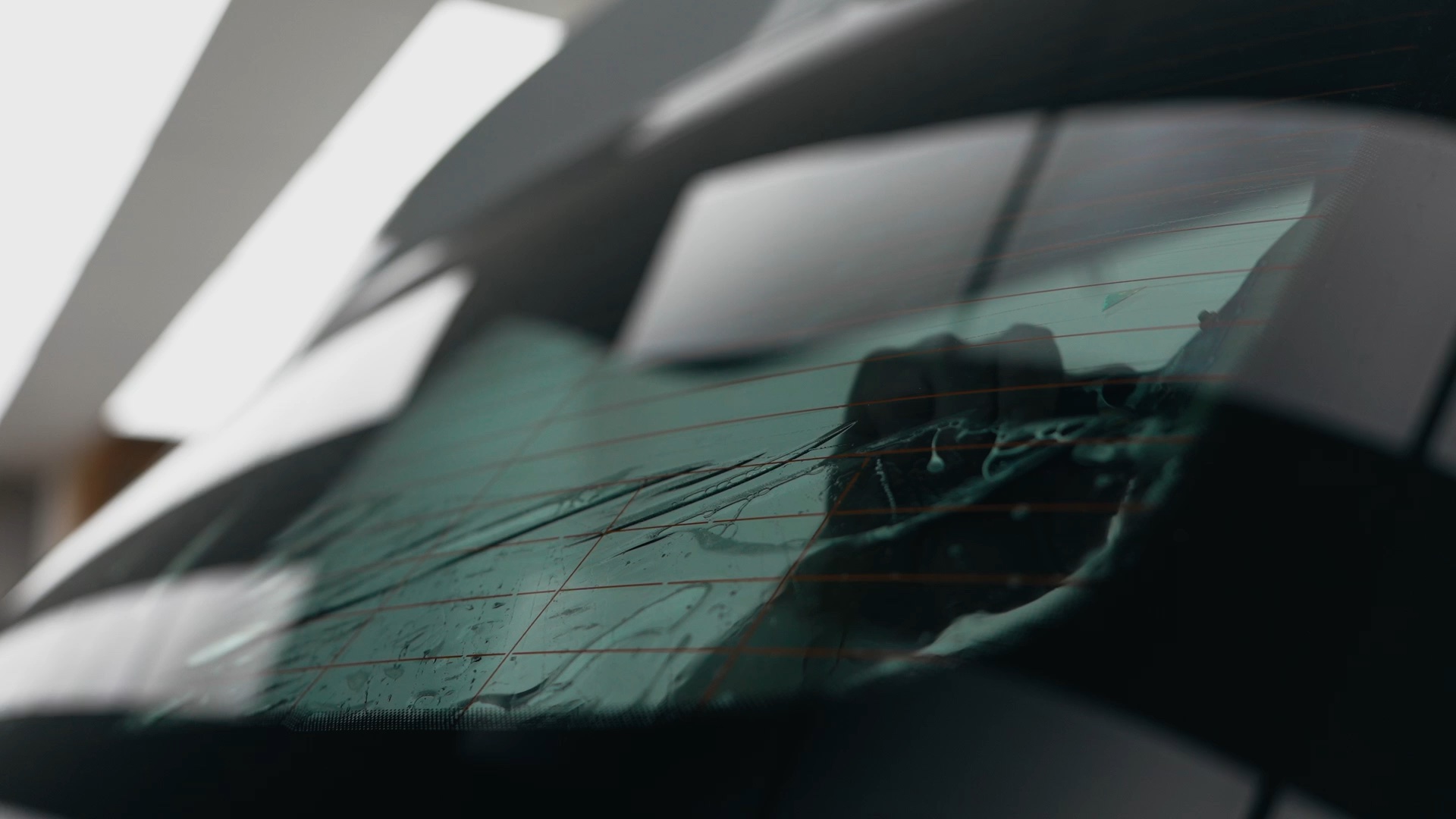 Tint film being fitted to a car window